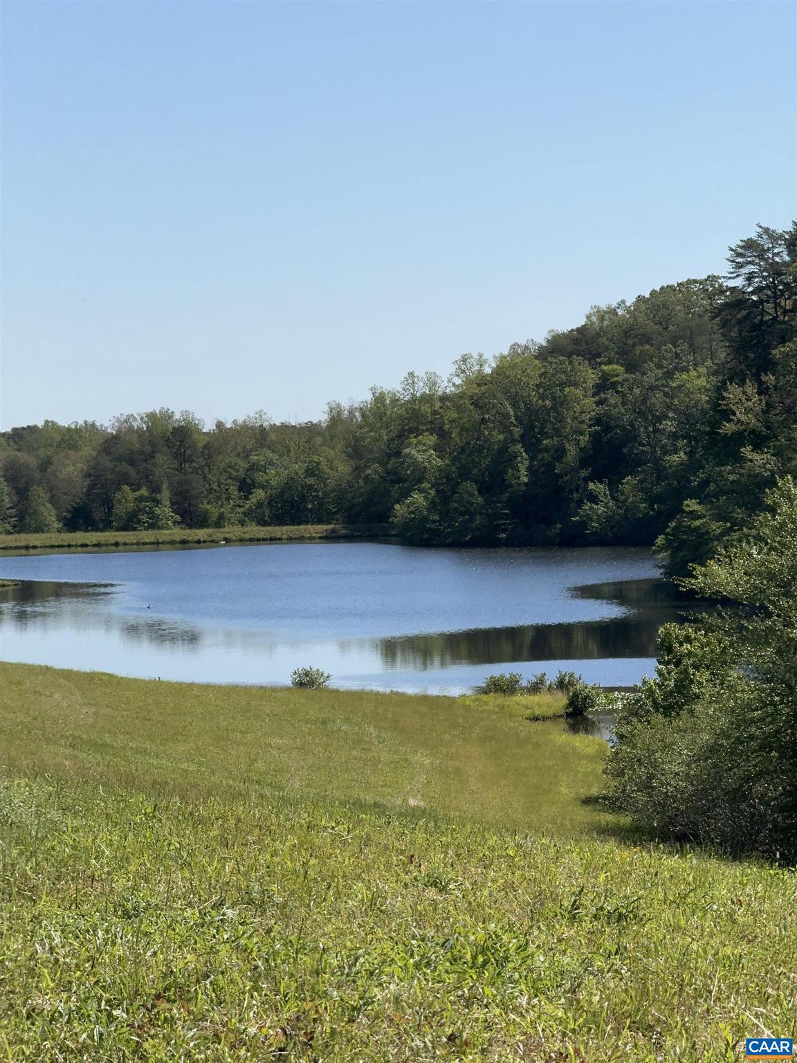 Jefferson Lake Farm - Incredible opportunity to own 1,156+ contiguous acres within 15-20 minutes of Charlottesville, UVA, Monticello and James Monroe Highland. Parcel features a private, well-stocked 12 acre lake plus a smaller 3-4 acre pond.  Wildlife galore with deer and turkey. Approximately 250+ acres of open pasture with remaining balance in mixed wood, with miles of streams and trails to enjoy this special parcel.  Improvements include 3 rental cottages, equipment shed/workshop and a barn.  This unique parcel is in a conservation easement with the Virginia Outdoor Foundation offering only 2 division rights.,Jefferson Lake Farm