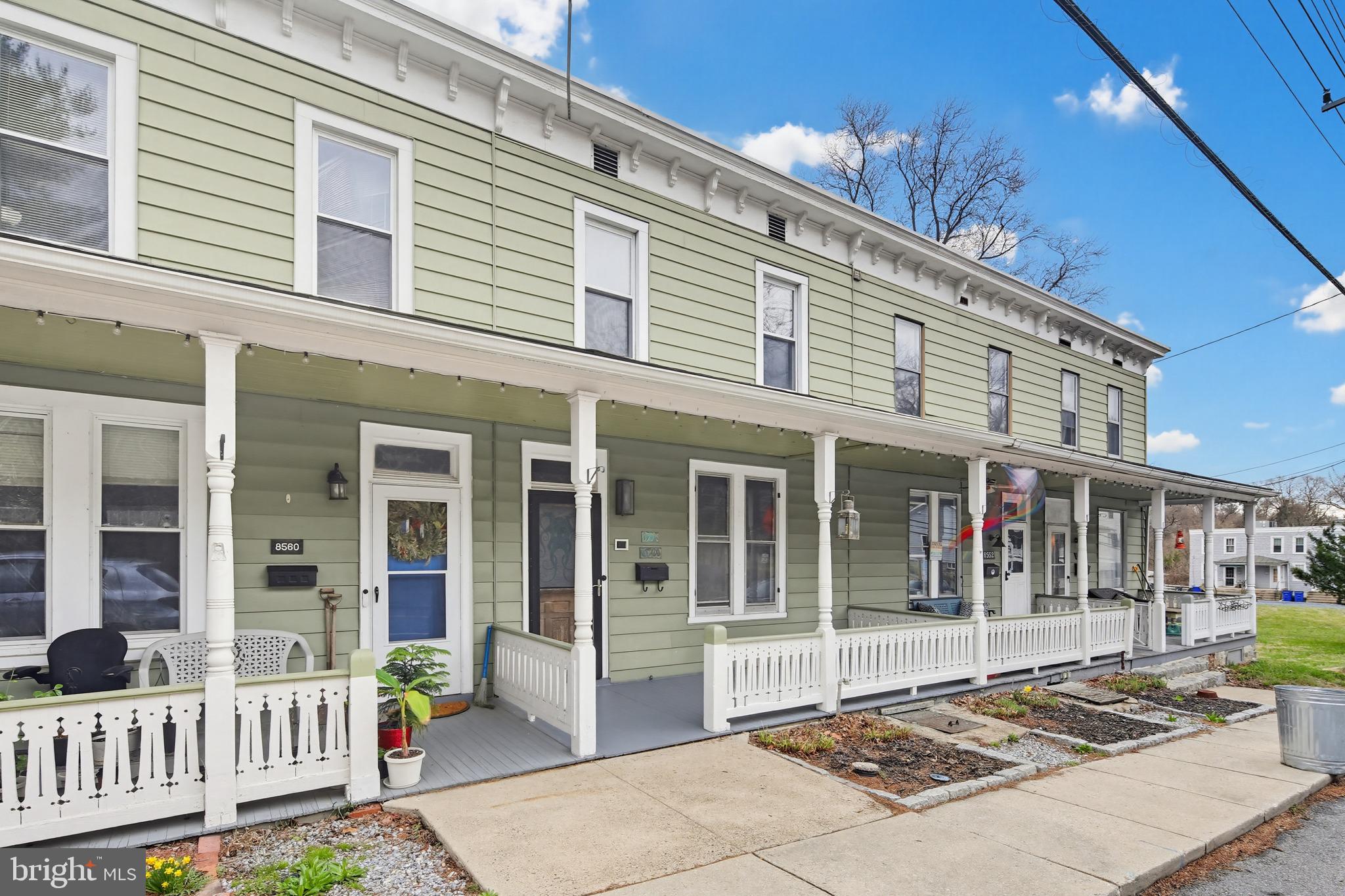 Welcome to 8556 Old Frederick Road in Old Ellicott City! 

Built in 1900, this remarkable home blends original period craftsmanship with thoughtful modern updates and carefully curated décor that enhances its historic charm.

Step through the original 1900 front door into the inviting living area, where the stunning millwork of the staircase and original hardwood floors—crafted from a now-extinct 126-year-old Georgia Heartwood pine—immediately capture your attention. The secondary living space showcases beautiful wainscoting, original trim work, and beautifully preserved wood flooring that reflects the home's rich history and character.

A truly unique statement piece awaits: a late 19th-century prison wall safe from Pennsylvania, complete with two hand-cut keys. Once used to house the levers that opened multiple cell doors, this fully riveted safe—with no visible exterior screws—serves as a fascinating and rare historical feature that once opened provides convenient storage.

Throughout the home, fully restored plaster walls, original trim, and detailed wainscoting highlight the exceptional craftsmanship and preservation.

The updated Art Deco–inspired kitchen perfectly balances old and new, featuring a Thermador gas range, open shelving, custom cabinetry, and a striking copper farmhouse sink that serves as the centerpiece of the space.

Just off the kitchen, the laundry area and main bathroom lead to the rear deck and an impressive 18x18 Pennsylvania bluestone patio—ideal for relaxing after a long day or entertaining guests.

Upstairs, you’ll find two generously sized bedrooms with original trim and 9-foot ceilings, along with a show-stopping primary bathroom featuring heated floors, period sconces, a large walk-in shower with bench and multi-head system, and a stunning 6-foot stainless steel 100-gallon soaking tub—the perfect place to unwind.

As you move through the home, you’ll be wowed by the abundance of original lighting fixtures, floor registers, antique doorknobs, antique doorbell, and high-end finishes that make it nearly impossible to choose a single standout feature.

Located in the heart of Old Ellicott City, this home offers walkable access to shops, restaurants, and everything the historic district has to offer, while also providing convenient access to major commuter routes, parks, and nearby shopping.