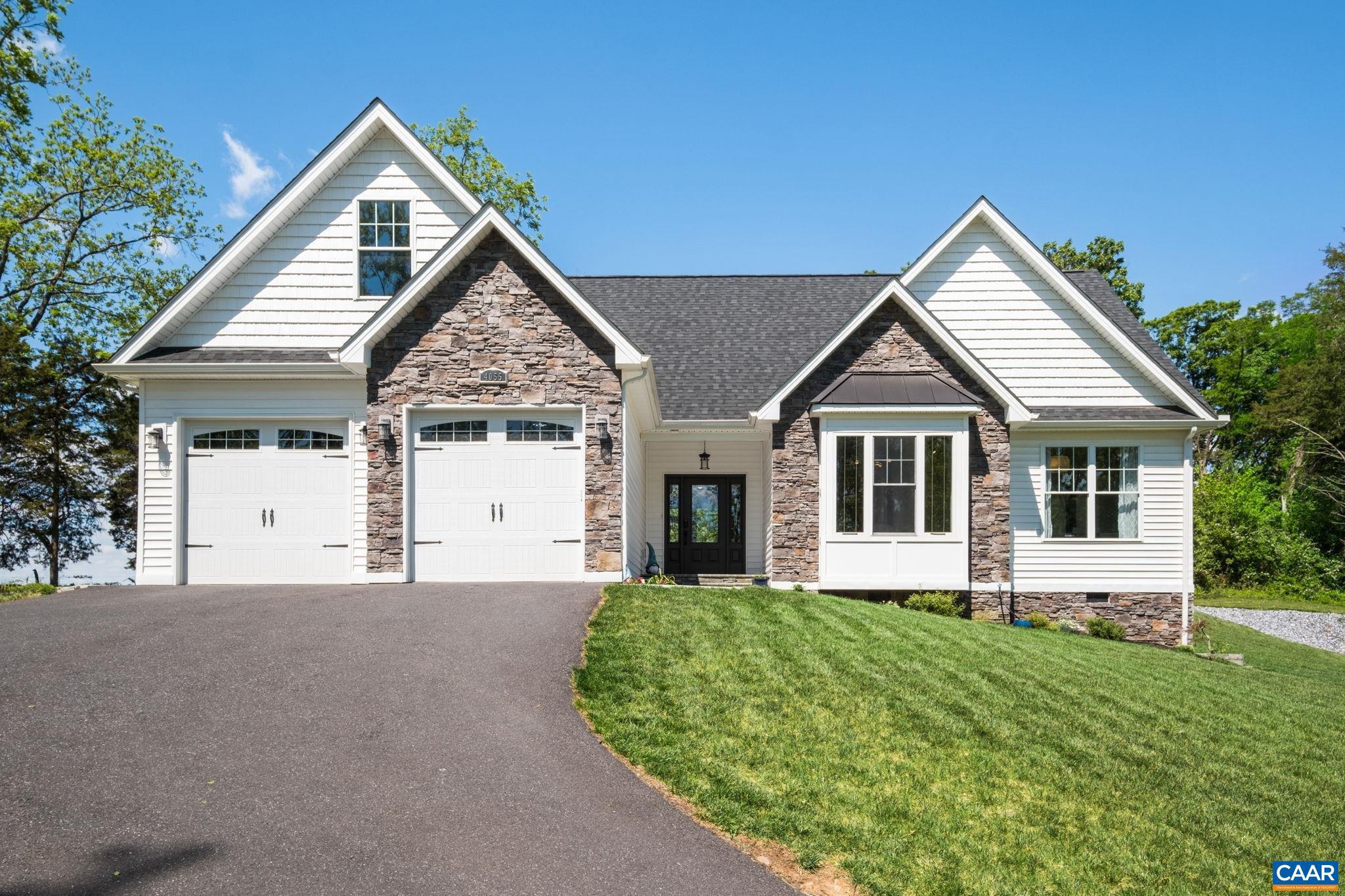 This special custom-built home features spectacular panoramic pastoral and mountains views, and with many showcase features, you will be ready to call it home. Built in '24, the home is better than new.  The large windows throughout the home showcase the picturesque mountain and pastoral views, from almost every room! The main living space features a custom-built brick fireplace surround, a focal point of the space, while coffered ceilings add elegance and dimension. The kitchen features a large island with plenty of cabinetry, a walk-in pantry, tile backsplash, and plenty of countertop space. The view from the kitchen window is picture perfect!  The sunroom features large windows to enjoy panoramic views, and a built-in corner cabinet.  The primary suite features a barn door closet and a small sitting area, and the primary bathroom features a garden tub, tiled shower, double vanities, and a water closet. Two bedrooms on the main level are currently used as home offices, and both feature lovely views.  Upstairs features two bedrooms with en suite bathrooms, and a large bonus room that offers versatile useage. The backyard is fenced, with a large stamped concrete patio, and two doors to the interior. A Tesla outlet conveys.,Quartz Counter,White Cabinets,Fireplace in Living Room