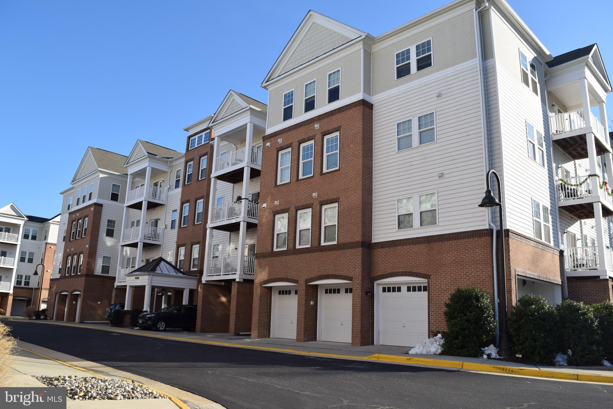 Welcome Home to this desirable home in a 55+ community! Located in the "The Villages at Broadlands", this stunning condo backs to a private tree line/wooded area! Interior features include 3 bedroom, 2 full baths plus a study/den.  This is the much desired Cambridge model by Van Metre Homes, has been well cared for by the original owner! Upgrades include a gourmet kitchen with a large walk-in pantry with ample shelving for plenty of storage space, stainless steel appliances and a breakfast / coffee bar! Primary bedroom has a large walk in closet, plus all three bedrooms have Elfa custom closets! Living room features include crown molding, a cozy gas fireplace and access to the private balcony. The Villages at Broadlands has access to all of the wonderful amenities that Broadlands has to offer! Plus, it's just a couple of miles to the new metro and walking distance to bus service, shopping, restaurants, pools and more. Welcome home!