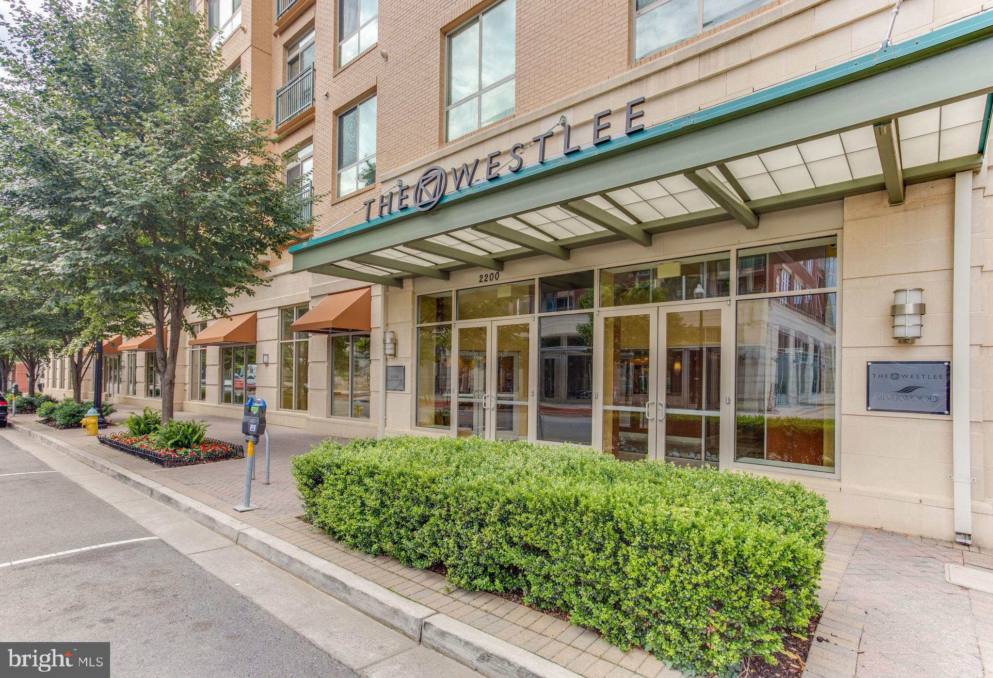 Welcome home to one of Arlington's most sought after neighborhoods. This bright, freshly painted one bedroom open condo located at The Westlee offers 12 foot ceilings, natural light and spacious living! Featuring a gourmet kitchen with granite countertops and granite kitchen island, gas cooking, oversized cabinets, and stainless-steel appliances. The unit offers a large master bedroom with large closet with built-in shelving and spacious bathroom. UNIT FRESHLY PAINTED. The Westlee offers secure building with concierge, gym, party room, pool table and bike storage. Amazing, walkable location. Blocks from the East Falls Church Metro Station. Only steps away from restaurants, coffee shops and retail shopping. One garage space included. Perfect living easily accessible to all major commuter routes: DC, Pentagon, Tysons Corner. W&OD Trail, only a block away. Pet friendly community. Dogs OK 25lbs limit with pet deposit. Professionally managed. Resident Benefits Package required for all leases. Condo move-in fees apply.