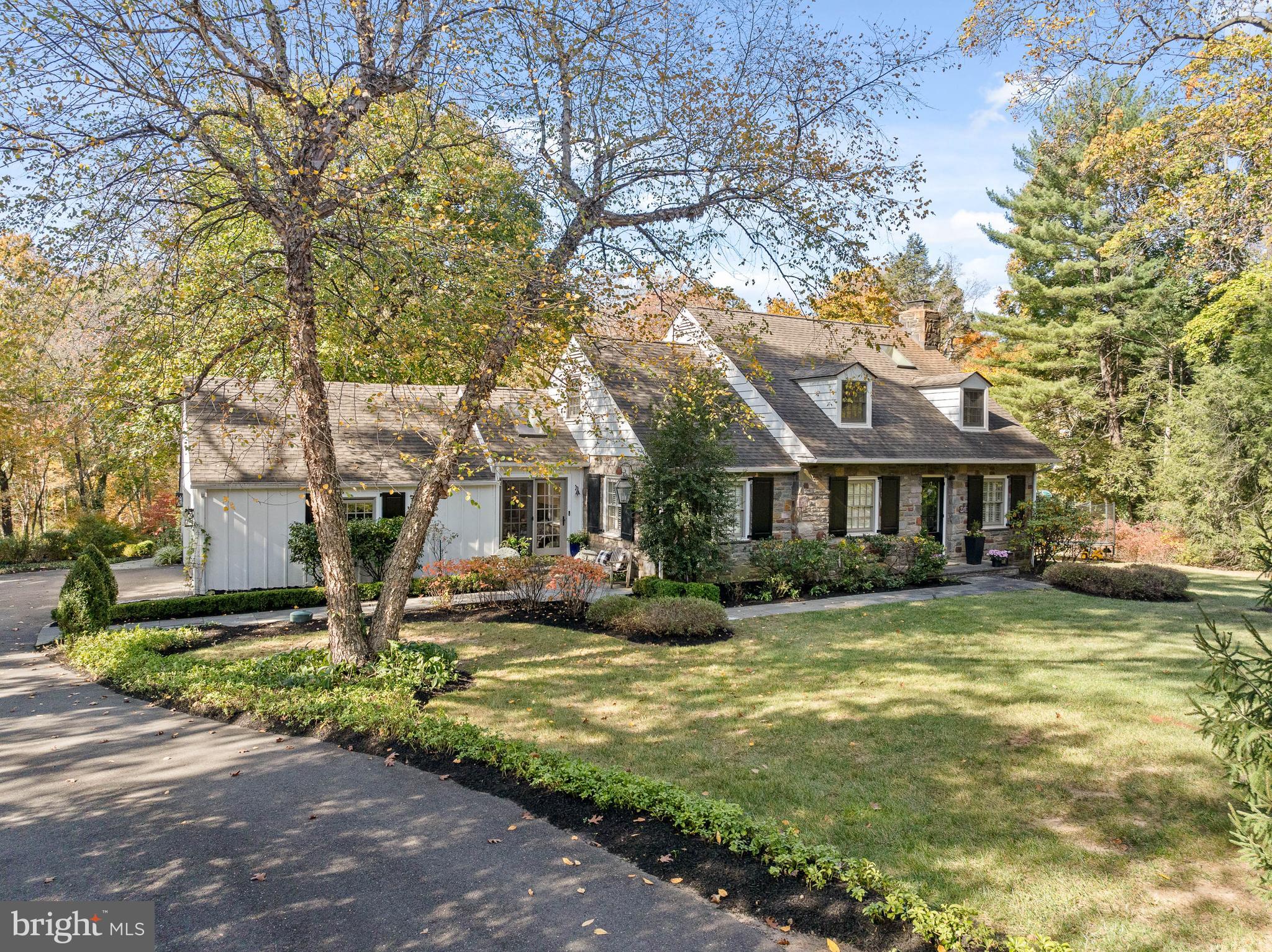 Welcome to 408 Youngs Ford Lane, a charming Cape Cod-style home that perfectly balances history, luxury, and comfort. Your heart is captured from the moment you approach the house, as this stunning Pennsylvania Fieldstone residence boasts a captivating street presence and welcomes you with unparalleled warmth. Upon opening the front door, the sunny disposition of this charming gem can be felt as gleaming hardwood floors extend throughout the First Level ,seamlessly connecting all of the rooms. The private wood-paneled Office, located just off the Foyer, offers a serene environment, with floor-to-ceiling bookcases, an ideal setting for work or reflection. The heart of the home lies in its bright, open living spaces, where natural light pours in through expansive windows and doors  that frame the breathtaking views of the magical backyard. The Dining Room, featuring a beautiful bay window, is perfectly positioned to capture the beauty of the outdoors, setting the stage for memorable meals and gatherings. It flows seamlessly into the large Family Room, anchored by a massive fireplace that serves as the room’s focal point. French doors open to a beautiful flagstone Patio that spans the length of the back of the house, with an awning that creates an outdoor room to be enjoyed year-round. The gourmet Kitchen is a chef’s dream, featuring top-of-the-line appliances, custom cabinetry, new countertops and backsplash. It conveniently opens to a  Breakfast Room with access to both the front and backyards, making it a bright and welcoming space for casual meals. The family-friendly design naturally flows into the mudroom, which provides access to the two-car attached Garage, offering ease and functionality for everyday living. The First-Floor Bedroom Ensuite provides a perfect space for guests or family members who prefer easy access to the Main Level, with an elegantly appointed Bathroom combining comfort and convenience. A charming Powder Room completes the First Floor. On the Second Floor is the spacious Primary Suite, a true retreat, complete with his and her walk-in closets and a luxurious Primary Bath. This stunning Bath features double vanities, a large shower, and elegant finishes. For added convenience, the suite also includes a Laundry Closet, making everyday chores a breeze. Connected to the Primary Suite, the homeowners cleverly converted a closet into an adorable Nursery, which could remain or restored to the original design of the Primary Suite.  Additionally on the Second Floor, there is a beautiful Third Bedroom featuring a built-in window seat and closet, adding both character and functionality. The Second Floor also features a charming Hall Bath that creates a cozy atmosphere, thanks to its floor-to-ceiling beadboard—a beautiful and functional detail that enhances the room’s warmth and character. The Basement is partially finished, with the most adorable Playroom you have ever seen, making it a fun space for children or family activities. There are endless possibilities to further finish the Basement while still leaving ample space for storage. Set in one of Gladwyne’s most coveted neighborhoods, 408 Youngs Ford Lane offers a rare find with a location that minutes from downtown Gladwyne while providing a secluded oasis to come home to and enjoy amongst 1.19 acres of lush greenery and mature landscaping. Whether you are looking to upsize or downsize,  this magical "right-size" home and property promises to provide years of cherished memories! Schedule your showing today..all showings begin  Wednesday 2/19 at 9:30 am