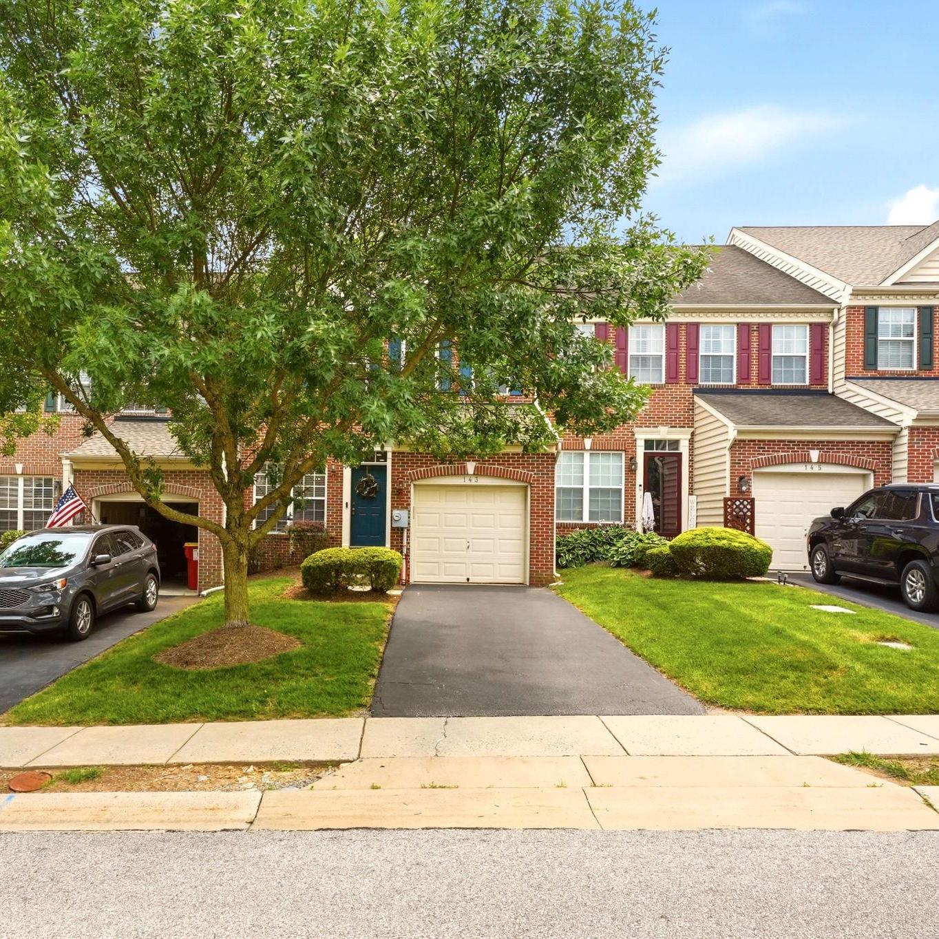 Welcome to 143 Penns Manor Drive in the highly desirable Penns Manor community! This beautifully maintained 3-bedroom, 2.5-bath townhome is just minutes from the heart of downtown Kennett Square. Enjoy the convenience of sidewalks that lead you directly into town for boutique shopping, dining, and all the charm Kennett Square has to offer. With easy access to Route 1 and everyday amenities just moments away, this location truly has it all.
Step inside to find beautiful refinished hardwood floors that flow throughout the main living area and into the kitchen. The spacious Living Room features recessed lighting, wainscoting, chair rail molding, and a versatile flex space that can easily serve as a formal dining area or home office. The Eat-In Kitchen is designed for both everyday living and entertaining, offering a large center island, pantry closet, stainless steel appliances, and an expansive dining area or cozy family room with a gas fireplace. From here, step outside onto the deck, complete with stairs leading down to the backyard. One of the standout features of this home is the backyard, which backs to open community green space, creating the feeling of an endless yard. It's the perfect place to relax, play, or enjoy the many neighborhood gatherings and community events hosted right outside your door. Completing the main level are a convenient powder room, a laundry room, and access to the attached one-car garage, which features a professionally finished epoxy floor.As you head upstairs, you'll immediately notice the beautiful custom moldings that add character and elegance throughout the hallway. The second level features a spacious Primary Suite with a walk-in closet and a private en suite bath complete with a soaking tub, double vanity, and tiled shower. Two additional bedrooms, including one with its own walk-in closet, provide plenty of space for family or guests. A full hall bathroom with a tub/shower combination completes this level. The finished lower level offers even more versatile living space, perfect for a recreation room, home office, or gym. With walk-up access to the backyard, abundant natural light, and a storage closet with rough-in plumbing for a future bathroom, this level offers endless possibilities.



The community features a playground and plenty of overflow parking for residents and guests. Additional updates include a new water heater in 2021 and a new HVAC system installed in 2022. If you’re looking for prime location, lifestyle, and low-maintenance living—this is it!