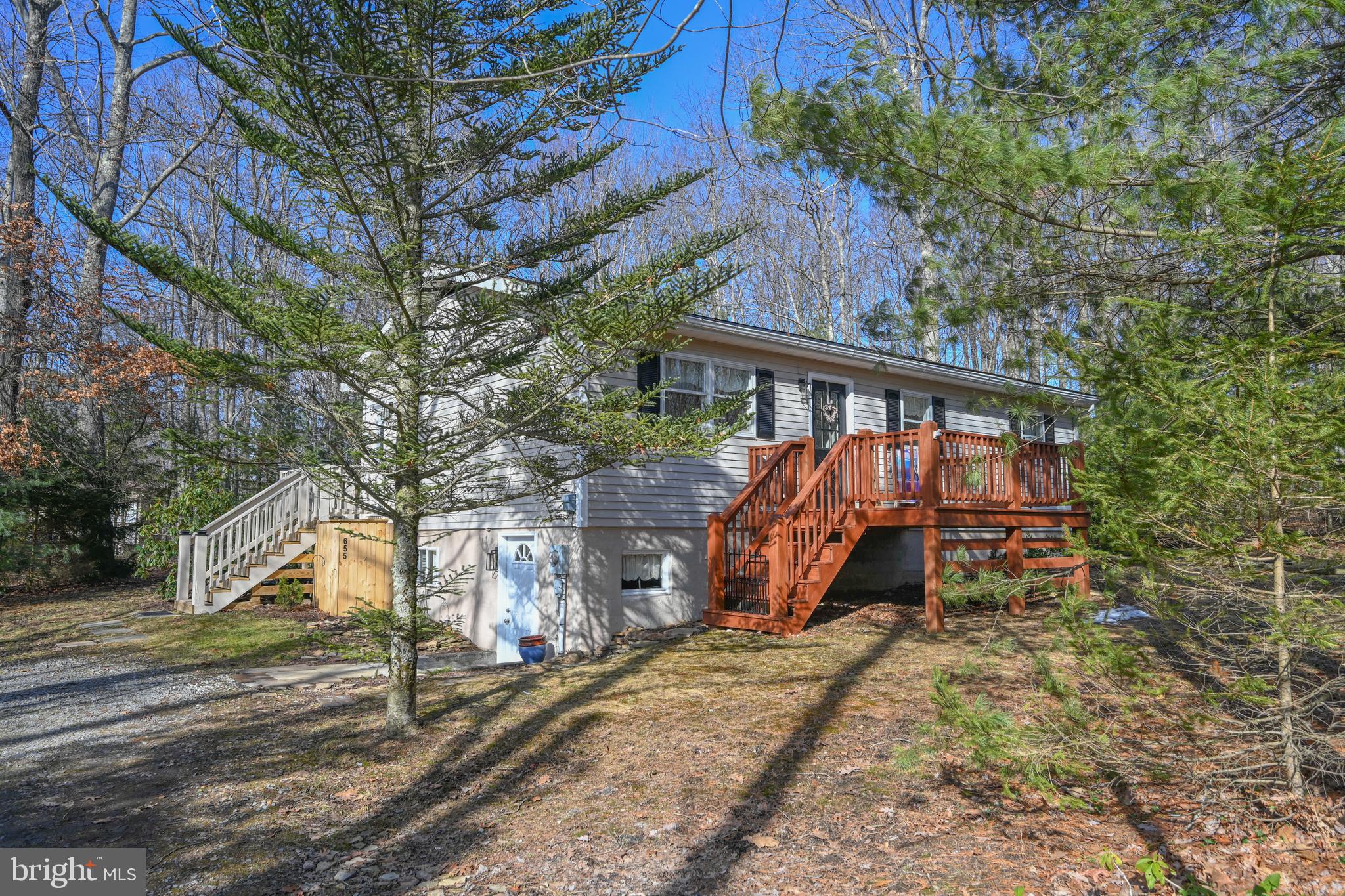 This cozy 2-bedroom, 1-bath home is full of charm and nestled in a peaceful, wooded setting among the pines. A front deck welcomes you inside to a warm living room with a gas fireplace, perfect for those cool mountain evenings. Just off the living room is a flexible space—ideal for a home office, reading nook, or cozy sitting area. An open spacious kitchen with new stove completes the living area picture.  New carpet in the main level bright bedrooms that look out at the pines. A charming bath is just off of the bedrooms. 

Need more space? The full, unfinished basement doubles the size of the home and is ready for your vision—whether it’s extra living space, a workshop, or storage. There is a pellet stove and new water heater added in 2024 in the basement. New washing machine in 2025.

Start your day with morning coffee on the back deck, and unwind in the evening while enjoying the sights and sounds of nature. The large, level yard offers plenty of space for outdoor fun, gardening, or simply relaxing under the trees.

Private and serene, yet just minutes from Deep Creek Lake, Swallow Falls, and Wisp Resort, this home offers the perfect blend of quiet retreat and adventure-ready location.

An incredible value for the amazing location at only $269,000—this is one you don’t want to miss!