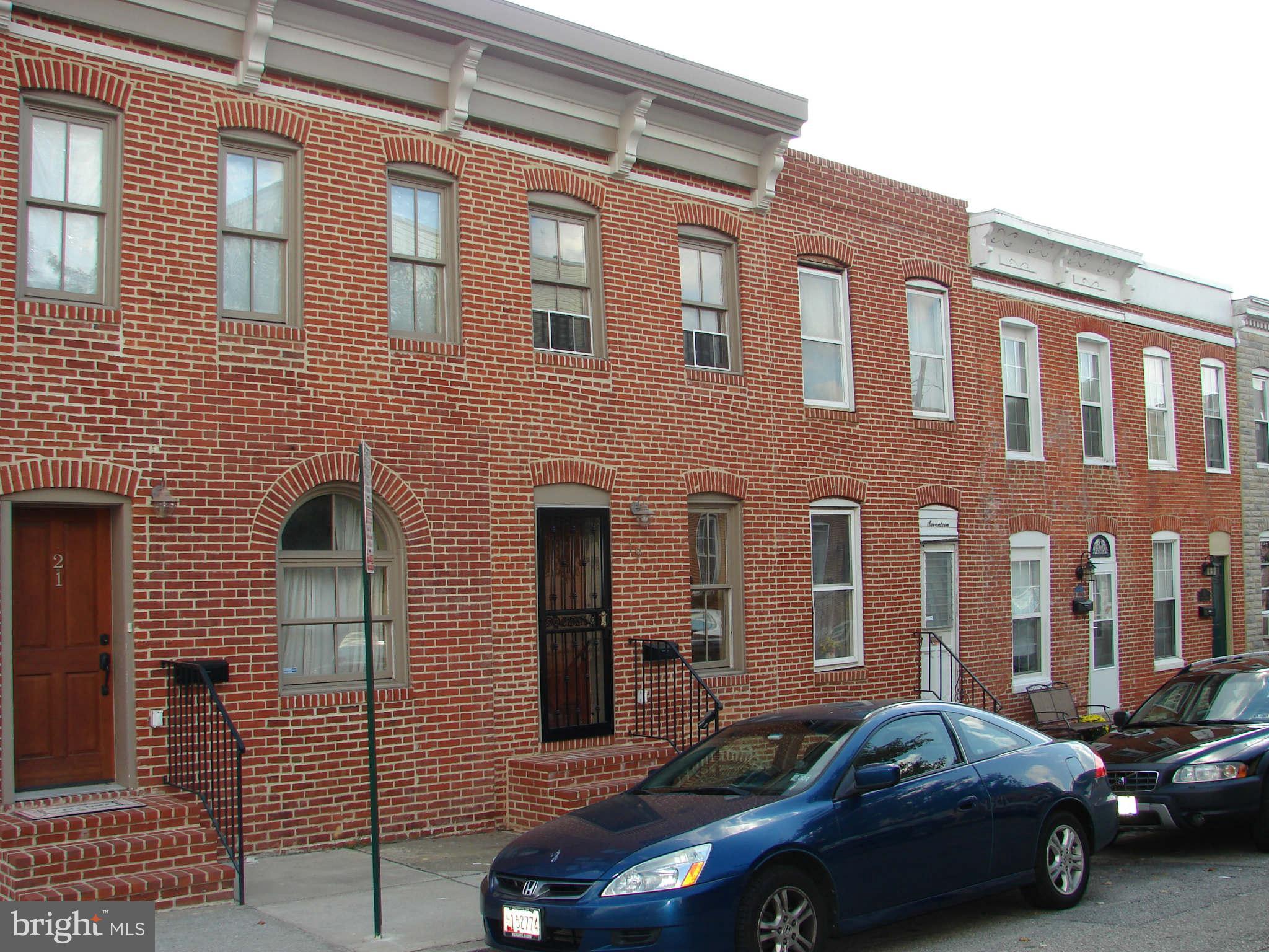 PRICE REDUCED $20,000!! Beautiful Renovation in Federal Hill with a GARAGE!  3 full and 1 half baths, upper level laundry room and fully finished basement with full bath.Unique kitchen and stunning hardwood floors make this a must see.  Easy access to 95 and Key Highway.  Freshly painted and ready to move in! Garage On n Patapsco St.  IT is the 2nd garage door closest to the alley.