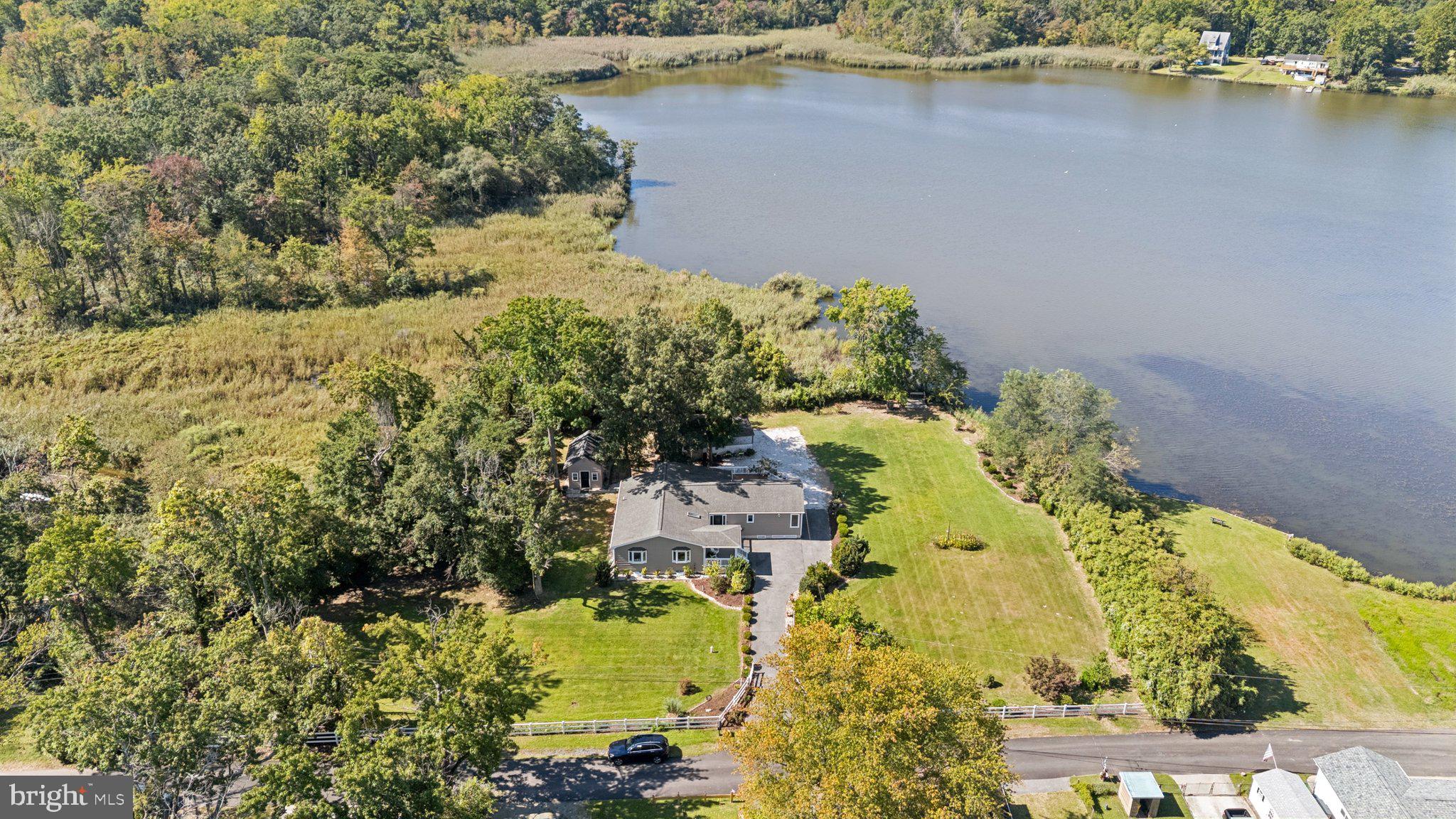 Welcome home to this charming home in an idyllic setting; a nature lover's paradise on just over an acre of land that abuts Hines Pond; one of largest lots in the neighborhood*Remodeled in 2014, it's a great year-round home or vacation home not more than 60 mins. from Baltimore and not more than 90 mins. from Washington, DC; not too far from Ft. Meade or the Naval Academy either*One-level living inside and out is what so many want today*Open floor plan with remodeled baths and kitchen including stainless appliances, granite counters, and an island large enough for bar seating*Huge primary bedroom with built-in king-size bed and headboard plus built-in entertainment center; walk-in closet; double-sink vanity in ensuite primary bath*Long driveway, garage, carport, and extra parking are perfect for multiple vehicles, family and friends*Bonus "she shed" with electricity!*Magical sunsets from the edge of the pond*1/2 block to private, community beach and tot lot*About 10 min. drive to Ft. Smallwood Park; a little longer to Crosspointe golf and several marinas*Extra bonus is delicious food from local restaurants*Lots of photos because of this amazing home and location!*Please note:  water frontage is estimated and Venice on the Bay is a civic association.