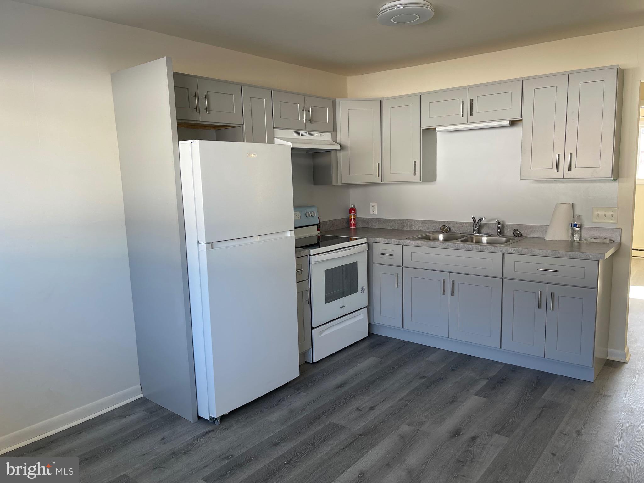 For rent is a first floor 2 bedroom apartment. Apartment comes with washer and dryer. Apartment has  electric baseboard heat and minisplit for A/C.  Fresh paint and flooring throughout. Apartment has brand new kitchen and appliances. Also comes with new washer and dryer. Comes with 2 off street parking spaces. Rent includes trash service. $30 nonrefundable application fee required per applicant and if selected $40 admin fee. No Smoking No Pets 615 Min. Credit Score
