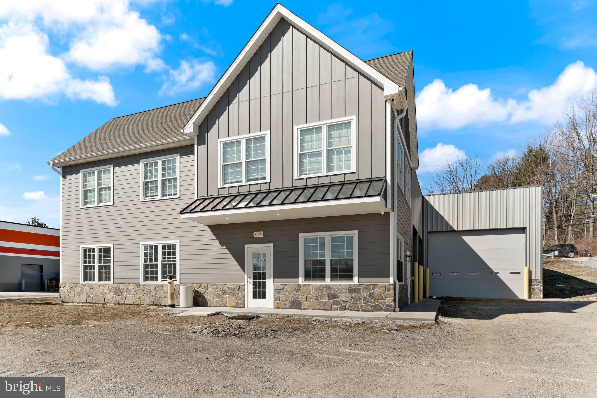 Rarely found 4468 SQ FT Shop with an additional 1728 Sq Ft of Office Space.  Perfect for your business to expand and grow!  Convenient location near the edge of Kennett Square Borough.  Come and join this bustling area!  Only 3 years young (built in 2022), the shop features 3 overhead doors, steel clear span construction with 20' ceilings and included shelving racks.  Shop also features a small bathroom and direct access to the front office area.  Front of the building features beautiful hardiplank siding with real stone and has 848 square feet on each level with a bathroom on each level as well.  Great place for a contractor to grow their business!  Exterior features parking for 10-12 cars.  Access to W. Cypress St, which is very busy road,  allows for a great place for signage and advertising for your business.  Public Water/Public Sewer/Natural Gas!
