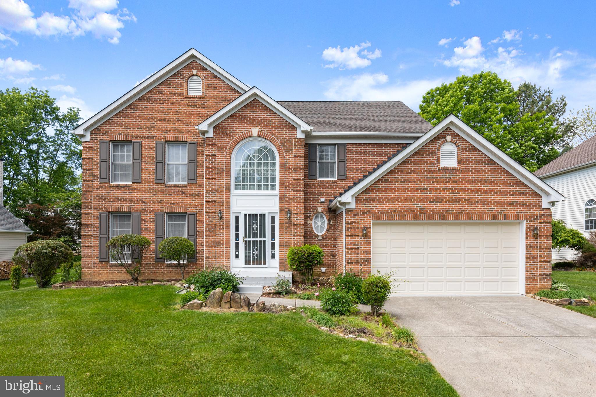 Welcome to this spacious brick-front colonial in the desirable Kings Charter community, offering one of the largest models in the neighborhood with a bright, functional layout and generously sized living spaces throughout.  The home has 4 bedrooms, 2 full and one half bath. The impressive two-story foyer creates an inviting first impression with hardwood floors and an open staircase, while the main level features multiple living and gathering areas filled with natural light.

The kitchen offers abundant cabinet and counter space and a sunny breakfast room surrounded by large windows overlooking the backyard. The adjacent family room features a wood-burning fireplace creating a cozy focal point for the space. Formal living and dining areas provide additional flexibility for entertaining, working from home, or everyday living.

The upper level includes a  full, spacious primary suite with luxury bath,  including soaking tub and separate shower, and double vanities with huge walk in closet. The additional bedrooms are generously sized, and share a lovely hall bath with double sinks. 
The lower level is unfinished and ready for your own personal design. It has  a rough-in for a future bathroom, offering excellent potential for additional finished living space.

Conveniently located near I-95, shopping, dining, and everyday amenities, this home offers both space and accessibility in one of the area’s most established neighborhoods.  New roof with special Lifetime Warranty, siding  & gutters (2025)Radon mitigation system already installed.