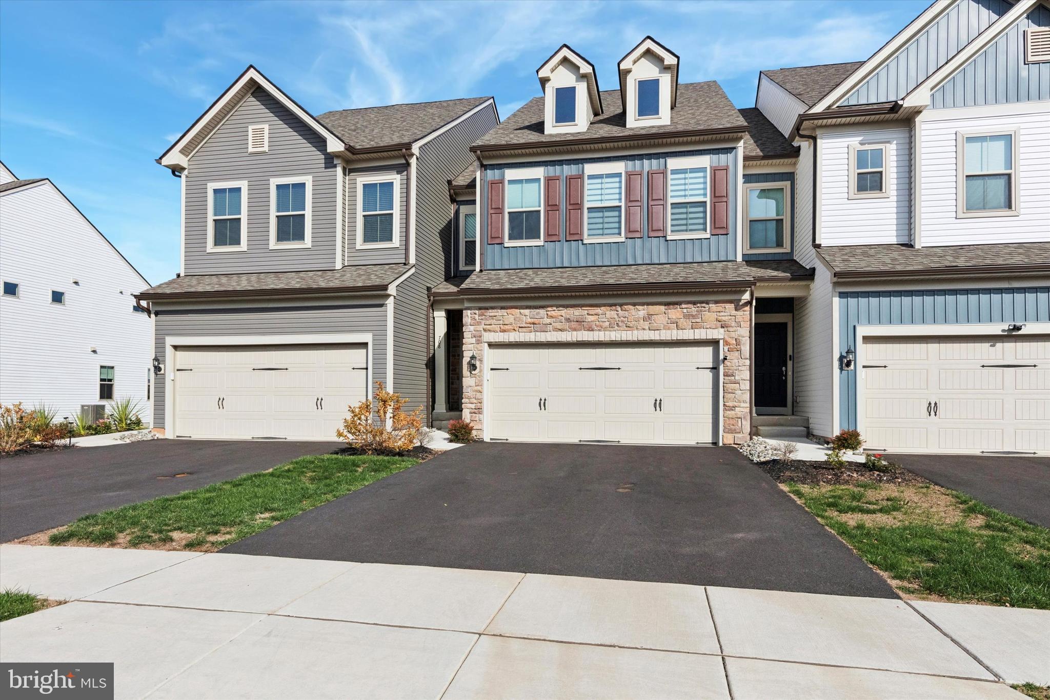 Newly constructed in 2024 by award-winning PULTE home builder, offers a blend of style, comfort and practicality. This stunning sophisticated modern designed townhome located in Franconia township nestled in the Award Winning Souderton Area School District, features a bright open floor plan, 3 bedrooms, 2.5 baths and attached 2 car garage w/inside access.  Entering into this beautifully maintained home offers all main living areas w/hardwood floors, recessed lights and 9ft ceilings. Open concept designed floor plan includes a naturally bright family room, a dining area w/sliding door to a maintenance-free trex deck and a kitchen with an expansive quartz center island, abundant cabinetry, gas range, built-in microwave, subway tile backsplash and a large deep sink. Spacious kitchen pantry, access to the garage and a convenience powder room complete this main living level. Ascending to the 2nd floor via a turned wooden staircase, a large primary bedroom suite offers ceiling fans, recessed lights and impressive walk-in closets. Primary bathroom equipped with a large stall shower w/tile surround, modern style rectangle double vanities and a linen closet.  There are two additional bedrooms also w/recessed lights, spacious closets, a conveniently located laundry room, hallway closet and a hall full bathroom with double vanities and tile surrounding bathtub. The full basement is unfinished, and could turn out to be your favorite entertaining space with your creativity and final touch.  This home is equipped with a durable 'Rinnai' tankless water heater, high efficiency HVAC and fire sprinkler system.  Enjoy the relaxed atmosphere of living in a peaceful setting close to nature while having superior schools, excellent shopping, and fantastic dining options.  Minutes away from the PA-Turnpike Lansdale exit, RT 63, Allentown Rd and local parks.