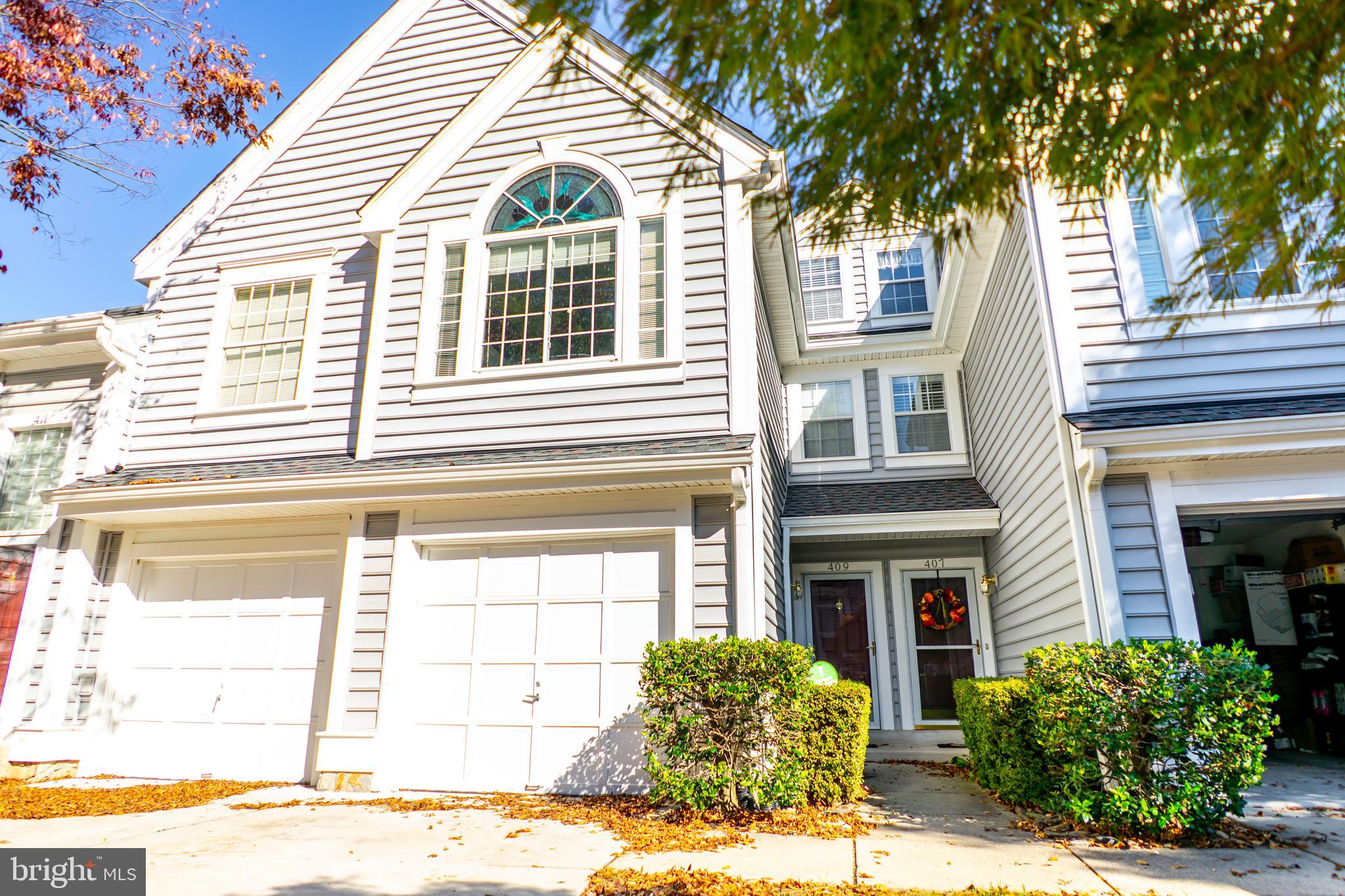 ONE  OF THE LARGEST  TWO BEDROOM CONDOS WITH THE LONGEST DRIVEWAY  IN BARRINGTON POINTE RIGHT ABOVE HISTORICAL OCCOQUAN AT ABOUT 2000 SQ FEET!!!***THIS HOME BOASTS OF TENDER LOVE AND CARE WITH MAJOR RENOVATIONS THROUGHOUT***SPACIOUS OPEN FLOOR PLAN WITH HIGH CEILINGS AND LOTS OF LIGHT WITH A FIREPLACE ON BOTH THE MAIN LEVEL AND UPPER LEVEL***WALK INTO AN OPEN FOYER FROM THE FRONT DOOR OR THE GARAGE, TO A TILE FLOOR, LAUNDRY ROOM AND STORAGE AREA, TAKE THE STAIRS (CUSTOM BUILT FOR ALL LEVELS) TO THE MAIN AREA WITH KITCHEN, DINNING ROOM AND LIVING ROOM AND AN OPEN STAIRWAY TO THE UPPER LEVEL WITH BOTH THE MASTER BEDROOM, SECOND BEDROOM, FAMILY ROOM AREA WITH A FIREPLACE AND LOFT***GLEAMING FLOORS ON BOTH MAIN AND UPPER LEVEL, CUSTOM BUILT KITCHEN WITH QUARTZ COUNTERS, SUBWAY BACKSPLASH, STAINLESS STEEL APPLIANCES, AND A QUARTZ WATERFALL PENINSULA BREAKFAST EATING AREA***CUSTOM PAINTED THROUGHOUT, BUILT IN BOOKSHELVES IN THE LOFT AREA, CUSTOM STAINED GLASS WINDOWS***ALL STAIRCASES WITH  METAL RAILINGS IN POWDER COATED BLACK, AND ALL ELECTRICAL OUTLETS WERE UPDATED TO FLAT SWITCHED AND WHITE FACES***THE CONDO FEE INCUDES THE AMENITIES, TRASH, WANTER AND SEWER, ALONG WITH ALL THE EXTERIOR MAINTENANCE, RECENT ASSOCIATION UPDATES TO INCLUDE THE ROOF AND SIDING, AND GUTTERS, ALONG WITH THE WATER CROCKS AND THE LANDSCAPING***DRIVEWAY CAN FIT TWO CARS EASILY, AND ONE IN THE GARAGE***JUST A FEW STEPS DOWN TO ALL THE GREAT SHOPS OF OCCOQUAN AND BEAUTIFUL VIEWS OF THE WATERFALLS
