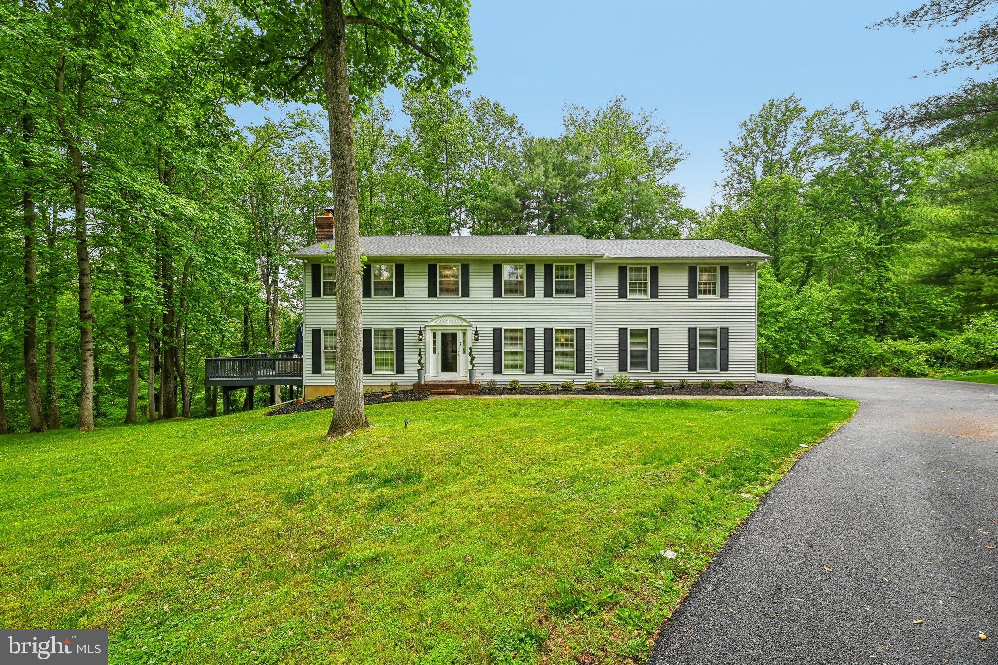 Welcome to 10 Delbarton Ct in Sparks Glencoe, Maryland—a spacious and beautifully appointed 4-bedroom, 4.5-bath single-family home with a 2-car attached garage perched upon a sprawling 1.63 acre lot. Thoughtfully designed for both everyday living and entertaining. Step inside to find warm new LVP flooring throughout the main level, creating an inviting and elegant atmosphere. Several Impressive accent walls throughout the home adds to the amazing aesthetic. The living room features a cozy fireplace and direct access to the large rear deck, perfect for relaxing or hosting gatherings while enjoying the peaceful surroundings. The main level also offers a formal dining room and a bright eat-in kitchen complete with granite countertops, stainless steel appliances, and ample cabinet space. Upstairs, the expansive primary suite serves as a luxurious retreat with its own fireplace, walk-in closet, and private en-suite bath. Three additional generously sized bedrooms including one with its own ensuite bathroom,  an additional full bathroom, and a convenient laundry room complete the second level. The finished lower level provides exceptional additional living space, including a large family room, a versatile bonus room ideal for a home office or potential guest bedroom, and a full bathroom—offering flexibility to fit your lifestyle needs. Nestled in the desirable Sparks Glencoe area, this home combines comfort, space, and functionality in a beautiful setting you’ll love coming home to. Nothing to do here but move in and enjoy. Welcome Home!  Mortgage savings may be available for buyers of this listing.