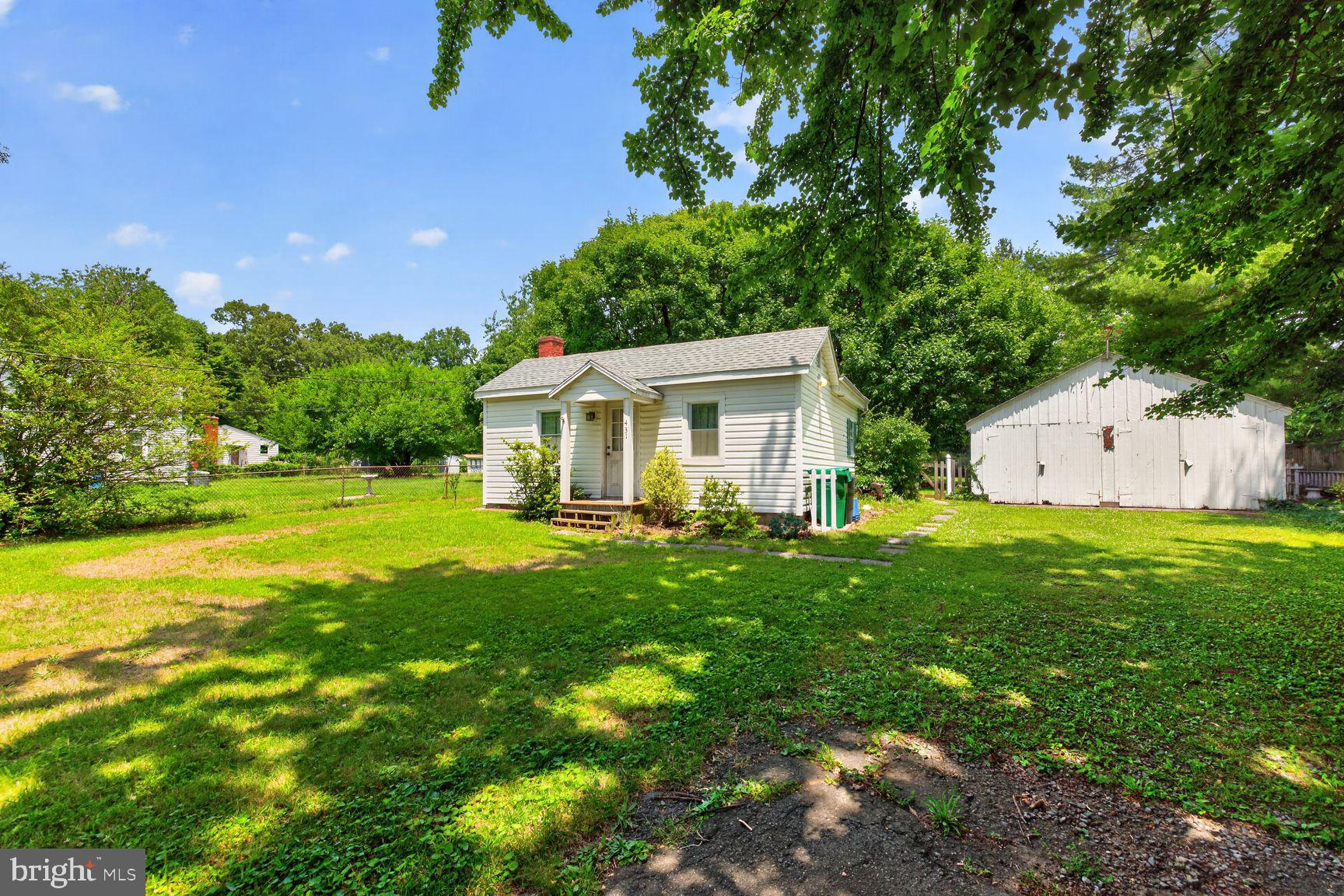 Welcome to 431 Gaither! This property is truly one of a kind, with an extraordinarily charming feel rarely found and endless potential. This is the opportunity of a lifetime for an investor/handyman- the adorable home is perfect for both a rehab or a teardown. Situated on half of an acre, a home with this size lot in a prime Gaithersburg location is hard to find. This whimsical home features a 9yr young roof, hardwood flooring, stainless steel appliances, a very well designed layout of bedrooms, an over-sized  bathroom,  a brick feature in the living room, ceiling fans, granite counters, a deck and so much more. The lot is endless, and offers 2 massive storage structures/barn , mature trees, and a flat never-ending backyard. Seconds from 270, rt 200, 355, the MARC Train, Downtown Gaithersburg and across the street from Bohrer Park. Close to Shady Grove Metro, tons of shopping (King Farm, Rio and Crown, Kentlands, Downtown Rockville) and so much more.  You have the best of both worlds: centrally located near everything  yet in the E. Deer Park neighborhood, that offers  an established neighborhood feel with large lots. NO HOA!! Being sold- as-is.