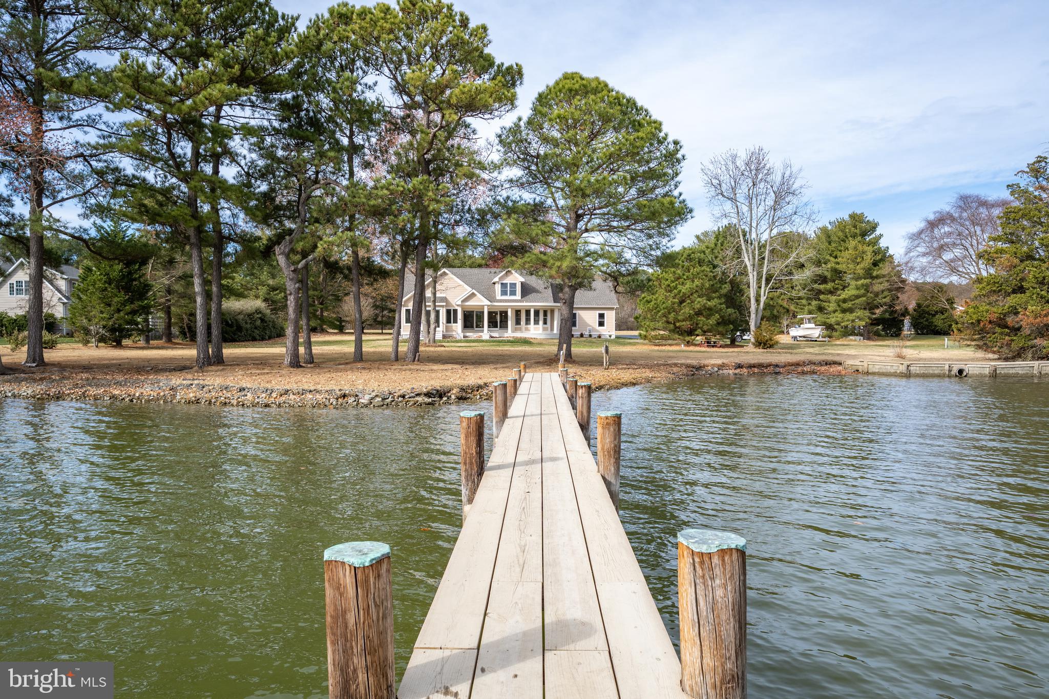 SELLER SAYS BRING ALL OFFERS!!!

Step into waterfront luxury with the spectacularly reimagined 4 bedroom, 3 bath custom home on Harris Creek meticulously remodeled by RBCI, Inc., an award-winning custom home builder.
Pool Permit in hand

 No expense was spared in creating this 2,731 sq. ft. masterpiece on over 1.5 acres of magnificent waterfront living.  New flooring, counter tops, appliances, garage floor, extended ceiling and walls in master, new vanities, tile, showers, tubs, lighting, carpet, paint, vinyl siding, roof, exterior lighting, driveway and more.  Front and rear of house have been reconfigured.  New doors, windows and sliders. HVAC is 8 years old.
Enjoy your own private deeded dock, complete with a 15,000 lb. boatlift and 5' MLW- perfect for the water enthusiasts. 
A sophisticated design includes hardwood floors and a gas fireplace providing a warm and inviting atmosphere throughout.
Entertain with ease in the chef inspired kitchen featuring quartz countertops, custom cabinetry, sub zero refrigerator and stainless-steel appliances including a built-in microwave, dishwasher and Blue Star 8 burner range with double door ovens.
The first-floor primary suite includes an en-suite bath featuring both soaking tub and shower as well as double vanity, granite vanity top and custom cabinetry.  A large walk-in closet also features custom shelving. Second floor finds two extra-large bedrooms and one bath.  Utilize one as a bedroom and the other is large enough to be a workout or playroom.  Both overlook the water.
A permit is in process for the new owner to construct a swimming pool, offering an opportunity to create your own dream backyard oasis.  
The home includes a two car garage and a large newly sealed driveway to house a multitude of vehicles.
All furniture and decor are intended for staging but can be purchased separately.
Mallard Point roads are scheduled to be widened in 2025.  Owner has paid this assessment.
This is your chance to own a luxurious retreat in a prime secluded location close to St. Michaels.
Schedule your private showing today!