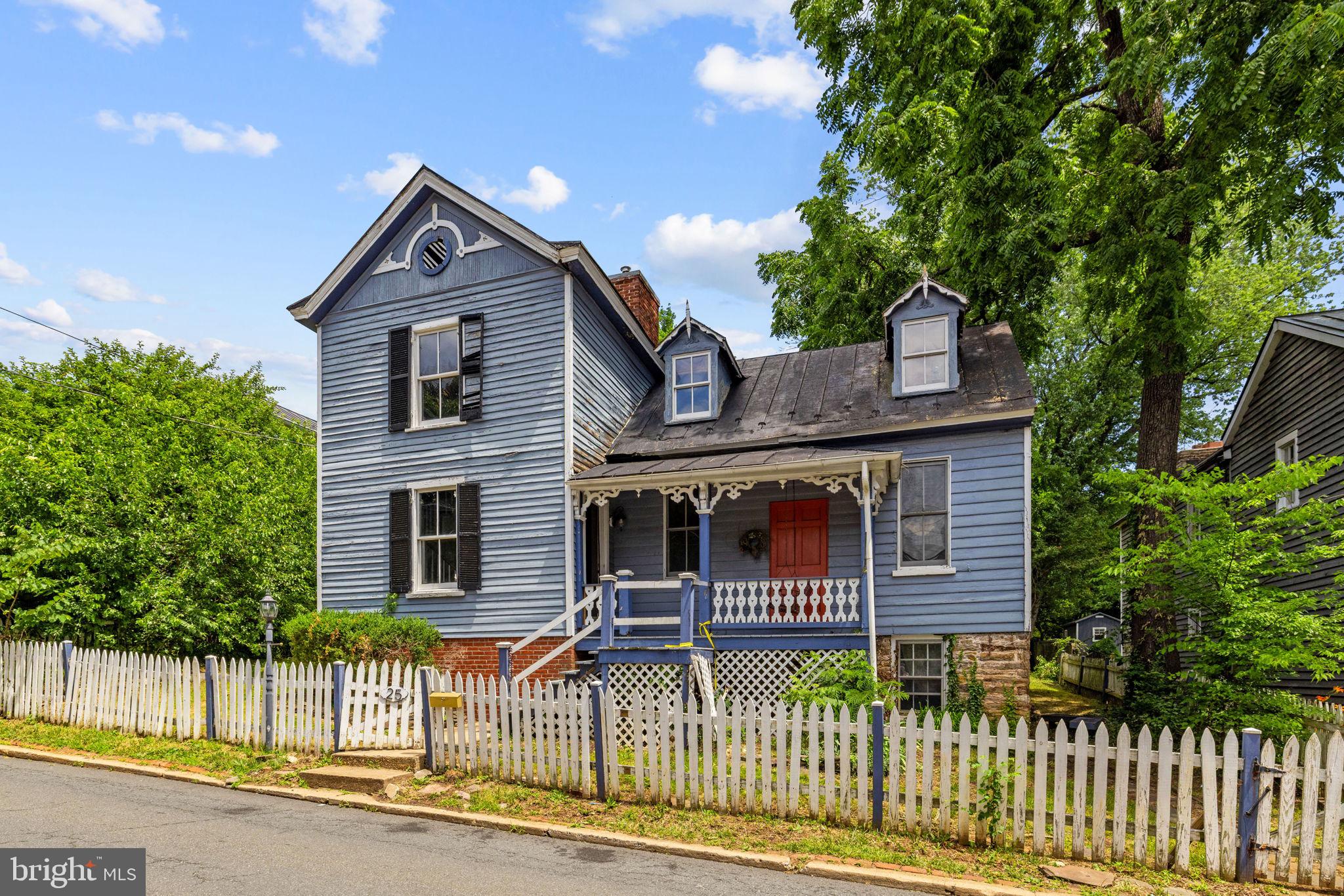 Historical home located in down town Warrenton. Very unique floorplan with English  basement containing the kitchen and family room with stone fireplace.  Wood floors, stone foundations, metal roof.  3 levels with 2 staircases going to the upper level.   Town utilities.  Lovely backyard area with rear deck  and shed. House requires total renovation. Seller has no details on components of this home.  Property sold strictly in "AS IS" Condition.  Bring your ideas and plans to renovate this charming home to the beauty that awaits.
