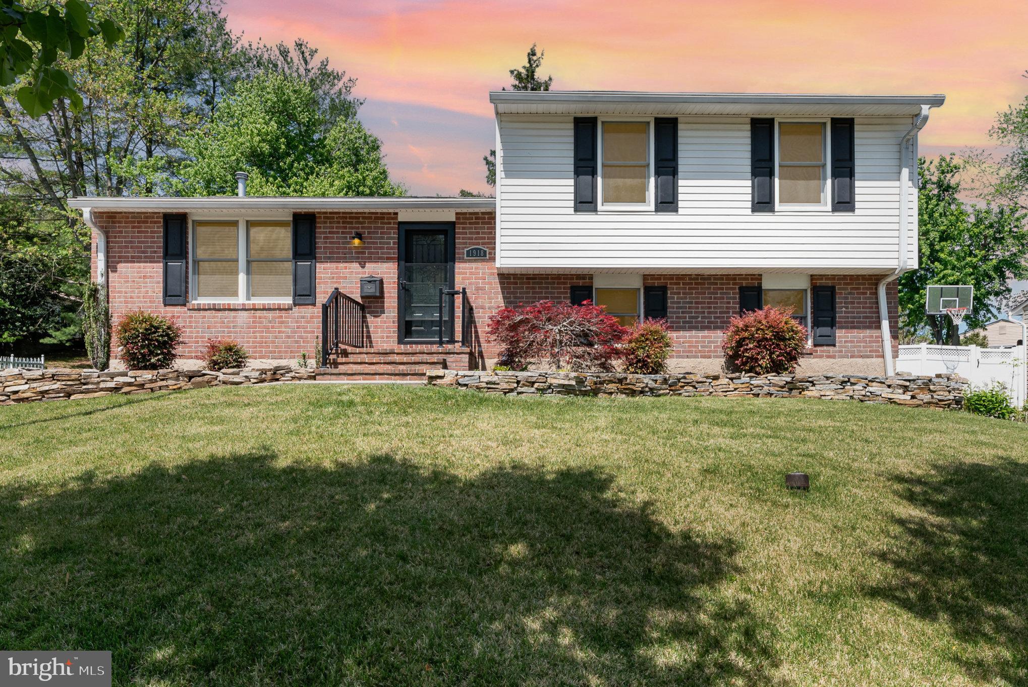 Expected on market date 5/2/25. Welcome to 1918 Westchester Avenue, a rare split level with three levels of finished living space and an unfinished basement with ample storage.  The main floor includes the living room and an open dining room/kitchen combination, all with hardwood floors. The kitchen has been updated with white cabinetry, granite countertops, stainless steel appliances and custom fittings to maximize storage.  On the top floor is the primary bedroom with ensuite bath, two generous additional bedrooms and an updated hall bath. On the floor below the kitchen is a family room with a walk out to the fenced back yard, a powder room and another bedroom with its own accessible ensuite bath. The lowest level is ready for all your storage needs.  Furnace and A/C were replaced in 2021 and a new water heater is being installed.  The larger of the two outdoor sheds has electricity. There is also a spacious deck off the main level for seasonal enjoyment.  Summer is great in 21228! Hurry to see this one before it's gone.