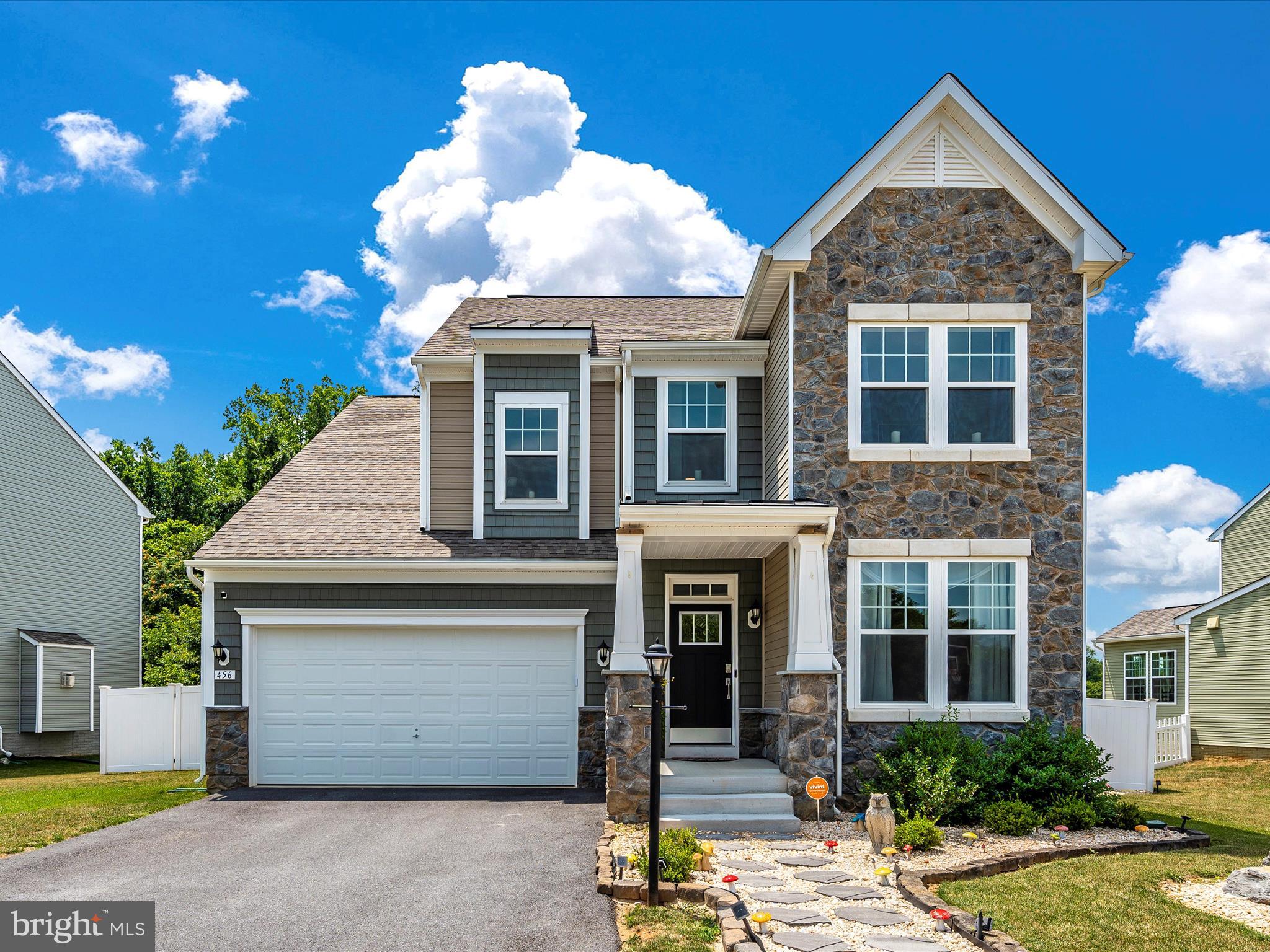 This exquisite 4-bedroom, 3.5-bath colonial home seamlessly blends traditional charm with modern upgrades. Upon entering, you'll be captivated by the spacious and inviting atmosphere. The heart of the house, the updated kitchen, boasts a stunning glass tile backsplash, a custom-etched glass pantry door, and under-cabinet lighting that illuminates the sleek countertops. Every room features upgraded lighting fixtures that add a contemporary touch and enhance the home's overall aesthetic.

The main living area is designed for both comfort and style. A 4' rear extension provides additional space, making the living room perfect for entertaining or relaxing. The centerpiece of this room is a beautiful stoned gas fireplace, offering warmth and ambiance. Throughout the house, upgraded flooring, including tile and Pergo, exudes quality and elegance, while the fully carpeted basement adds a cozy feel.

Upstairs, the large primary bedroom is a serene retreat, featuring tray ceilings that add a sense of grandeur. The primary bath is nothing short of a private spa, with stunning tile work, gorgeous vessel sinks, and lighted antifog mirrors. The highlight of this luxurious bathroom is the astounding soaking tub and the expansive walk-in shower, designed for ultimate relaxation.

The upper level also includes three additional well-appointed bedrooms, each with ample closet space, and another full bathroom that has been tastefully upgraded. This ensures comfort and convenience for family members or guests.

The fully finished basement offers a versatile rec room, perfect for a home theater, gym, or play area, along with a full bathroom. This space is adaptable to meet any needs you may have.

Outside, the backyard is an oasis of tranquility. A composite deck provides the ideal spot for outdoor dining and relaxation, while the large yard, backing up to trees, offers privacy and a sense of seclusion. The fully fenced yard ensures safety and security, making it a perfect space for children and pets to play freely.

This home is a perfect blend of luxury and functionality, designed to meet the needs of modern living while offering a warm and welcoming atmosphere.