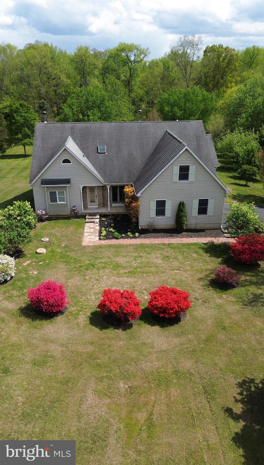 This exquisitely maintained 8 bedroom, 4 full baths and 2 half bathroom, 2 car garage residence offers an exceptional blend of comfort, space, and character, with thoughtful details and amenities throughout. The main level features four generously sized bedrooms, two full bathrooms and two half bathrooms, including a luxurious owner’s suite complete with a private sitting room and wood-burning stove, two walk-in closets, and a spa-like bathroom with soaking tub. Designed for both everyday living and entertaining, the first floor also includes a formal dining room, inviting living room and eat-in kitchen.  A bright and airy four season room overlooks the secluded backyard and surrounding woods, creating a peaceful year-round escape. A walk-in pantry and a spacious laundry room with abundant storage add to the home’s practicality, while tongue-and-groove hardwood floors bring warmth and elegance throughout.  Upstairs, a second private suite offers a large bedroom, full bath, and walk-in closet—ideal for guests or multigenerational living. This level also includes three additional bedrooms, a kitchenette, and a stunning open family room with built-in bookshelves and a wood-burning stove.  An expansive unfinished basement provides endless possibilities for customization. Outdoors, the property is equally impressive.  Set on 3.6 private acres, the property is bordered by Leyland cypress and Southern pine trees, offering exceptional privacy.  Located in the desirable Pearce Creek community and served by the Cecil County school district, this extraordinary home offers a rare opportunity to enjoy refined living in a serene, natural setting.