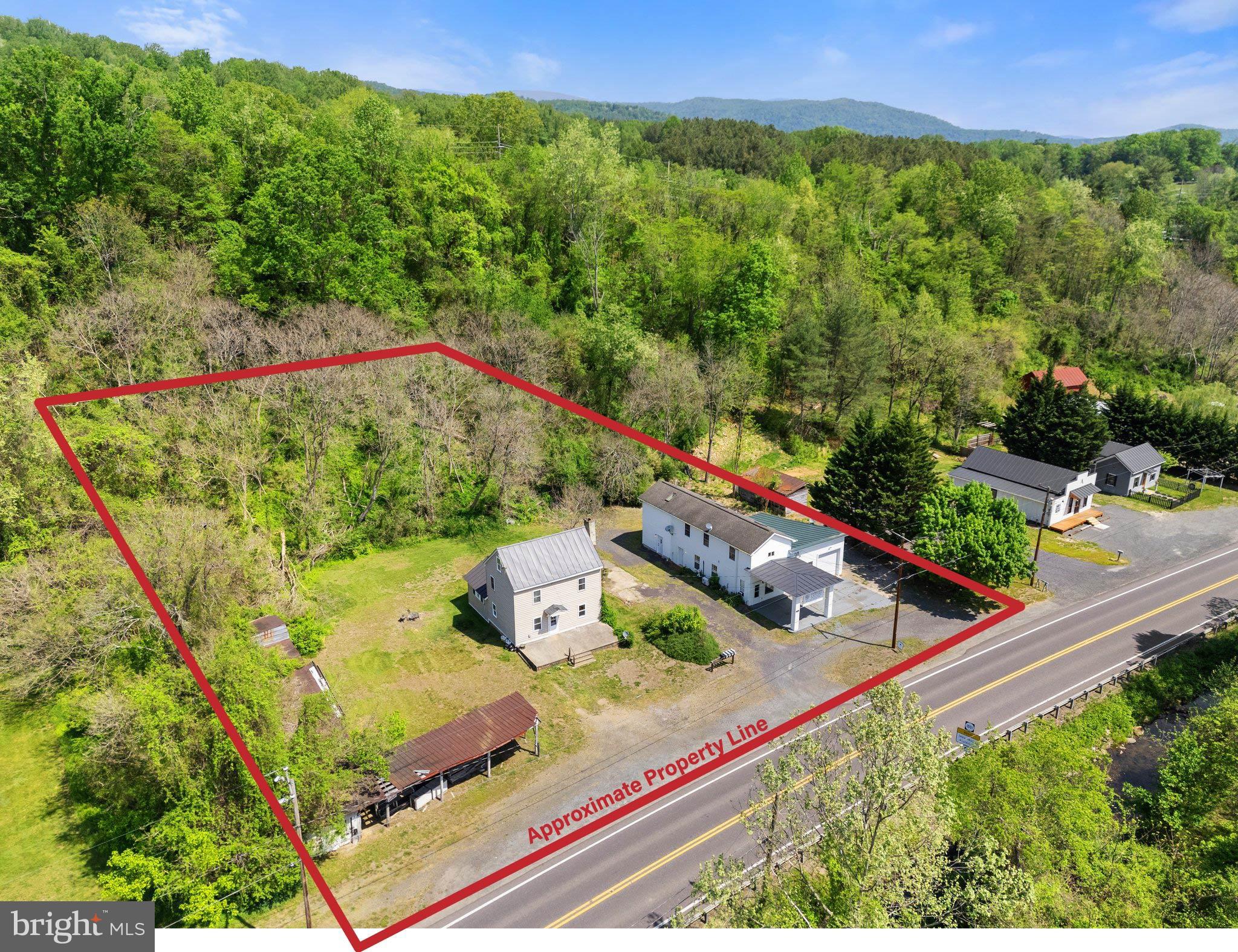 SHOWING BY APPOINTMENT ONLY.  DO NOT DISTURB TENANTS. 

 Live in one unit and receive rental income from the rest!  A very rare offering in Rappahannock County - 11947 & 11951 Lee Hwy, together for sale as one parcel, present an outstanding opportunity for multi-family rental income. The sale includes two structures containing FOUR grandfathered residential units, ONE commercial unit. Further upside can be realized by finishing unused spaces, bringing current rents to market rate and even rehabbing an old fruit stand on the property.  This investment opportunity sits on the highly traveled Rt 211: a major artery seeing 2 million + vehicles per year and opportunistically near the Thornton Gap entrance to Shenandoah National Park.  The property is zoned Highway Commercial, allowing for a multitude of by-right uses including short term rentals, retail, food service and hospitality.  Property is served by electric, propane, private well, town sewer and high speed is internet.  P&L available.