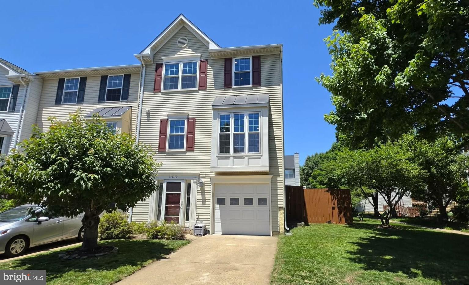 Welcome to this WONDERFUL End-Unit Garage Townhome in a SUPER Location * Close to Everything, yet tucked away in the LOVELY Tranquil Community of Englewood Mews * Just Minutes to I-66, Routes 28 & 29, Restaurants, Theaters & MORE * This Well Maintained Home offers NUMEROUS Updates including: NEW A/C (2025), NEW Water Heater (2026), NEW Replacement Windows & Exterior Doors (2016), NEW Roof (2013) & NEW LED Recessed Lighting Throughout * Enjoy OVER 2,000 Square Feet of Living Space on 3 Levels * The CONVENIENT Ground Floor Entry boasts a NICE BRIGHT Foyer with 18” Tile Flooring, a LARGE Coat Closet, the Door to the Garage & a HANDY Walk-in Closet with a Utility Sink (plumbed for a Powder Room) * The Laundry Room is located in the Hallway at the bottom of the stairs * The BIG Rec Room offers NEWER Pergo Flooring, a Brick Hearth Fireplace with Gas Logs, Built-in Desk with Shelves & a Sliding Glass Door to the Fenced Rear Yard * GREAT Space for Kids, Pets or Gardening with Grassy Areas Behind & Beside the Home * The Main Level boasts a HUGE Kitchen with BRAND NEW Quartz Countertops, Stainless Steel Appliances, Tile Flooring & a SUNNY Breakfast Room with a Double Door Pantry * The Family Room & adjacent Dining Room are Versatile & BRIGHT with French Doors to the EXPANSIVE Deck * Enjoy Outdoor Dining & Relaxing on the Deck with Gated Stairs leading down to the Yard * The Upper Level features a NICE Sized Primary Bedroom Suite with Vaulted Ceilings, a BIG Walk-in Closet & a Luxury Bath with Soaking Tub, Tiled Shower & Dual Sink Vanity * 2 More Bedrooms & a Full Bath in the Hallway finish off this level * Community Amenities include: 2 Tot Lots (1 is just steps away), Tennis & Basketball Courts & access to the NEARBY Walney Mills Swimming Pool