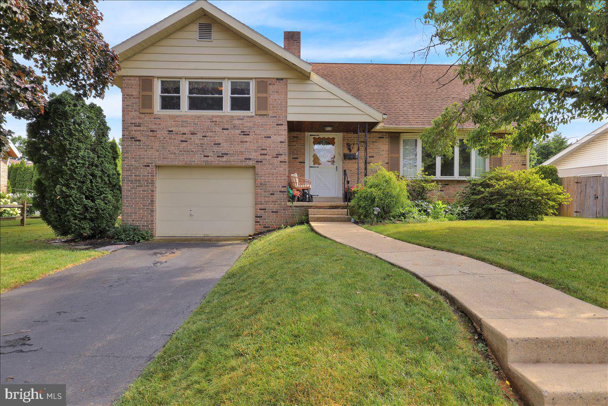 Fantastic Spring Twp location!  Nicely landscaped yard with great curb appeal in convenient neighborhood close to schools.  Inside you'll find recently refinished hardwood flooring in most of the first 2 levels.  Enter into a large living room with a woodburning fireplace.  Around the corner is a dining room with new ceiling fan.  The kitchen is original but is in good shape.  Up to the next level you'll find 3 bedrooms with hardwood flooring and a full bath.  One more level up is the attic or 4th bedroom with large closets.  Down one level is a spacious family room with new flooring and another full bath.  Another level down is a large unfinished basement with laundry.  A covered back porch and flat yard complete the home.  Schedule your showing today!