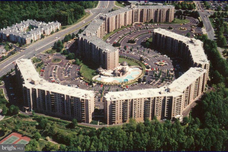 Large 902 sq. ft. +117 sq. ft. glass enclosed sunroom 1 BR/ 1BA Open Floor, in Tysons' Rotonda Gated Community across the street from the BORO! 24/7 Security, Wood and Marble floors, granite tops, SS appliances. Two Silver Line Metro stops,  Indoor/outdoor pools, sauna, tennis courts, basketball, golf putting, billiards, convenient store, salon, storage and a lot more! Access by appointment.