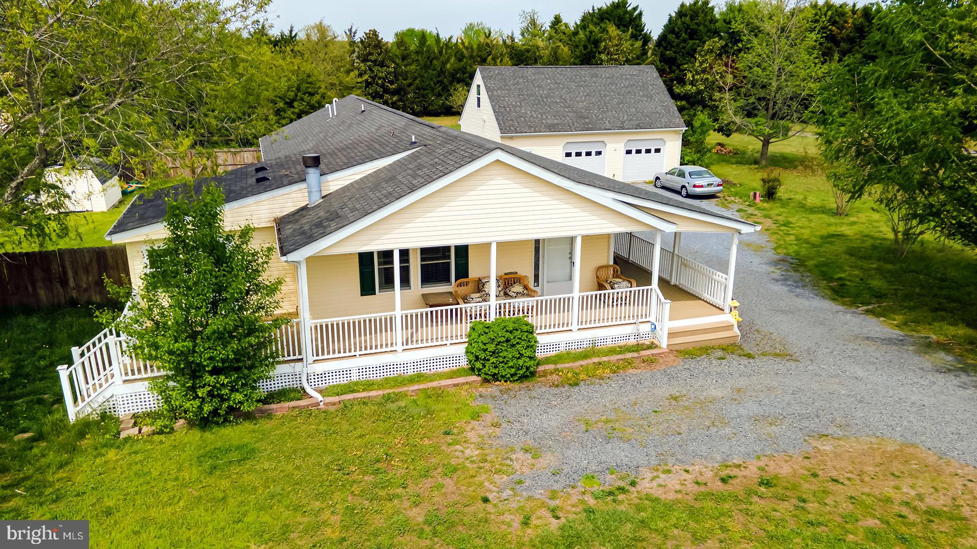 This is a truly rare and versatile opportunity to own a one-of-a-kind property offering two separate
dwellings with the potential to build an additional home—making it ideal for multi-generational living,
investment, or a private farmette lifestyle. Situated on a full acre with no HOA restrictions, the possibilities here are endless. The main home features 3 bedrooms and 2 full bathrooms, designed for comfortable everyday living. A standout feature is the oversized garage with a 1-bedroom, 1-bath apartment complete with a kitchenette, creating a second living space perfect for extended family, guests, or rental income. The property offers incredible flexibility, including potential for commercial use and the opportunity to connect to sewer—opening the door for future expansion, additional dwellings, or business
ventures. Enjoy peaceful outdoor living with a charming wrap-around deck, all while being conveniently
located near Long Neck and the Delaware beaches. Located in the desirable Love Creek School
District, this property combines location, freedom, and opportunity. Whether you’re looking for an affordable multi-generational setup, an income-producing property, or a homestead with room to grow, this unique property delivers unmatched potential in a prime coastal location.