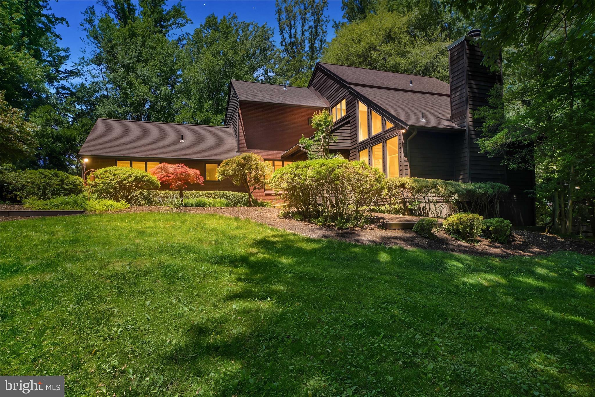 Nestled on a beautifully landscaped and wooded lot in a private cul-de-sac, this spacious 5-bedroom, 4 full-bath home offers timeless style, standout amenities, and numerous recent improvements. The main level features gleaming hardwood floors, abundant natural light, an elegant formal living room with cathedral ceilings, fireplace, and dramatic floor-to-ceiling windows, formal dining room, spacious family room, convenient mudroom off the garage entry, and a massive laundry room with extensive cabinetry and utility sink.

Designed for both everyday living and hosting, the gourmet kitchen features granite countertops, a center island with cooktop, double wall ovens, oversized built-in full refrigerator/full freezer, pantry, breakfast bar, and a generous breakfast nook with seating for many. A striking double-sided stone fireplace creates a warm focal point between the kitchen and family room.

Upstairs, the owner’s suite offers a private retreat with its own fireplace, walk-in closet, and spa-like bath with soaking tub and separate shower. Three additional bedrooms complete the upper level, including one with its own en suite bath, plus a spacious hall bath.

The finished walkout lower level adds exceptional flexible living space with a full bath, massive recreation area, bonus room or 5th bedroom, and abundant storage.

The property sits on nearly an acre, offering peaceful wooded views and exceptional privacy, with a combination of wood fencing and invisible fencing surrounding the entire property. Enjoy an expansive deck, pool with hot tub, and inviting lounge area perfect for relaxing or entertaining. A dedicated workshop/shed with electricity provides flexible space for storage, hobbies, or a workspace. Don't miss this rare opportunity to enjoy space, privacy, and resort-style living in a sought-after cul-de-sac setting.