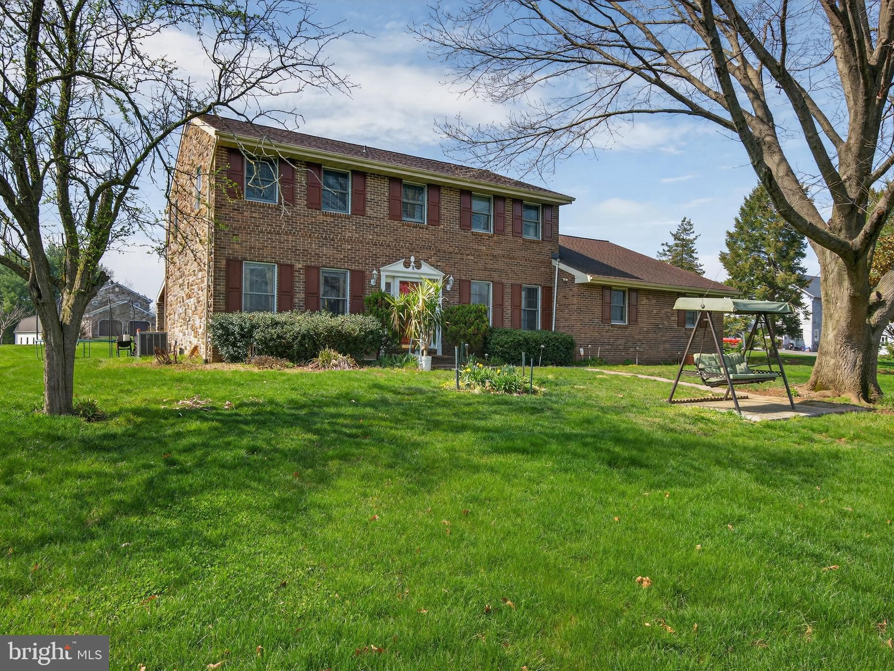 Welcome to 2 Wildflower Lane, Lancaster! Set on almost one acre, this corner lot is a beautifully maintained home and has been thoughtfully updated throughout the owner’s tenure, offering modern comfort and inviting living spaces inside and out. Outdoor enhancements include a concrete patio with stamped tile flooring, faux brick siding, and a covered patio with pillars—perfect for relaxing or entertaining.

Inside, the kitchen features granite countertops, wide‑plank hardwood flooring, and sleek stainless steel appliances. The fully remodeled basement adds valuable finished space with new drywall, flooring, a full bathroom, plus a bar area and pool table, creating an ideal spot for gatherings and recreation. Pride of ownership shines throughout, making this home truly move‑in ready.