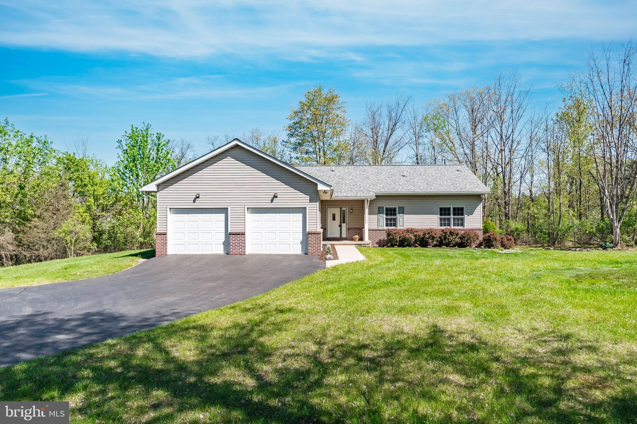 MULTIPLE OFFERS RECEIVED. HIGHEST & BEST DUE SUNDAY 5/4 BY NOON. Get ready to fall in love with this meticulously maintained ranch home, situated on nearly 3 acres in the heart of Coopersburg and Southern Lehigh School District. This charming 3 (possible 4) bedroom, 2 bath home features convenient one-floor living with beautiful views, eat-in kitchen with full table space, living room with propane gas fireplace and the convenience of main floor laundry. The primary bedroom suite features vinyl floors, a walk-in shower, single vanity with Moen fixtures and a private water closet with pocket door entrance. The finished basement offers an additional 1,275 of living space with family room, bedroom, ready to finished bathroom, additional storage space and walk out. The rear yard is an absolute sanctuary with mature shade trees and Trex deck. This home is a rare find in a sought-after location, providing a unique opportunity to enjoy the beauty and charm of Upper Saucon Township. Don’t miss the chance to make this cherished home your own!
