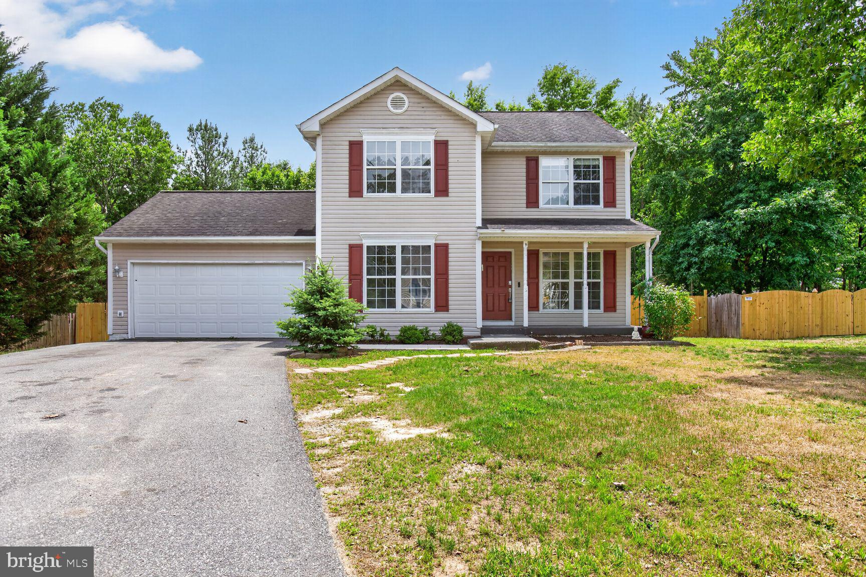 Tucked away on a quiet cul-de-sac in the highly sought-after Lancaster Gate community, this beautifully renovated 3-bedroom, 2.5-bath home offers the perfect combination of modern updates, flexible living space, and an oversized .68-acre lot. With 1,590 square feet and a 2-car garage, this inviting home welcomes you with a bright, open layout designed for both everyday comfort & entertaining. The updated kitchen serves as the heart of the home, featuring new stainless steel appliances, quartz countertops, and timeless white shaker cabinetry. Two separate living areas on the main level provide endless possibilities, whether you need a home office, media room, play space, or cozy retreat. A charming fireplace adds warmth and character, while the dining area opens to an expansive rear deck that is ideal for relaxing evenings, weekend gatherings, & outdoor entertaining. Step outside to discover a huge backyard with room to roam, garden, play, or simply enjoy the privacy and space that are increasingly hard to find. Upstairs, the spacious primary suite impresses with vaulted ceilings and a beautifully refreshed private bath featuring a new vanity, mirror, and lighting. Two additional generously sized bedrooms, all equipped with ceiling fans, offer comfortable accommodations, while the conveniently located upstairs laundry area includes a new washer and dryer. NEW HVAC unit, fresh paint and durable, easy-care flooring throughout create a bright, move-in-ready feel. Enjoy access to a community park and playgrounds, all while being just minutes from schools, shopping and dining. Close to I-95, Route 1, and the VRE, making this home an exceptional blend of peaceful neighborhood living and everyday convenience.