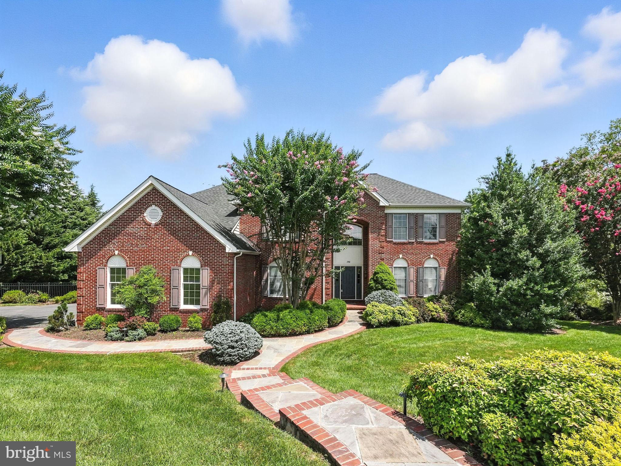 Tucked away at the end of a quiet cul-de-sac in sought-after Hunter Mill Estates, this beautiful home offers refined living on a wooded, private lot. Set on over half an acre and backing to trees, it combines tranquility with convenience just minutes from major commuter routes, the Silver Line Metro, and Reston. The main level features hardwood floors, formal living and dining areas, and a large renovated chef’s kitchen with granite countertops, stainless steel appliances. The family room, anchored by a cozy fireplace and beautiful entertainment center, opens seamlessly to the outdoor entertaining spaces. A spacious mudroom with built-in cubbies adds everyday functionality. Upstairs, 4 generously sized bedrooms provide comfort and flexibility. The primary suite boasts a spa-like bath and a walk-in closet with custom organization, while the remaining bedrooms are appointed with plush carpeting and ample storage. The fully finished, walk-out lower level includes a large bedroom, large recreation room with gas fireplace, full bathroom and versatile bonus spaces for work, fitness, or guests.  Outside, a true backyard retreat awaits — featuring a Viking outdoor kitchen with granite countertop, a custom stone patio with wood-burning fireplace, and a refinished Brazilian Ipe deck with enclosed gazebo. The fenced yard is enhanced by extensive landscaping and vibrant gardens, creating a serene setting for relaxation and entertaining. This exceptional property offers timeless comfort, stylish upgrades, and a premium Vienna location.