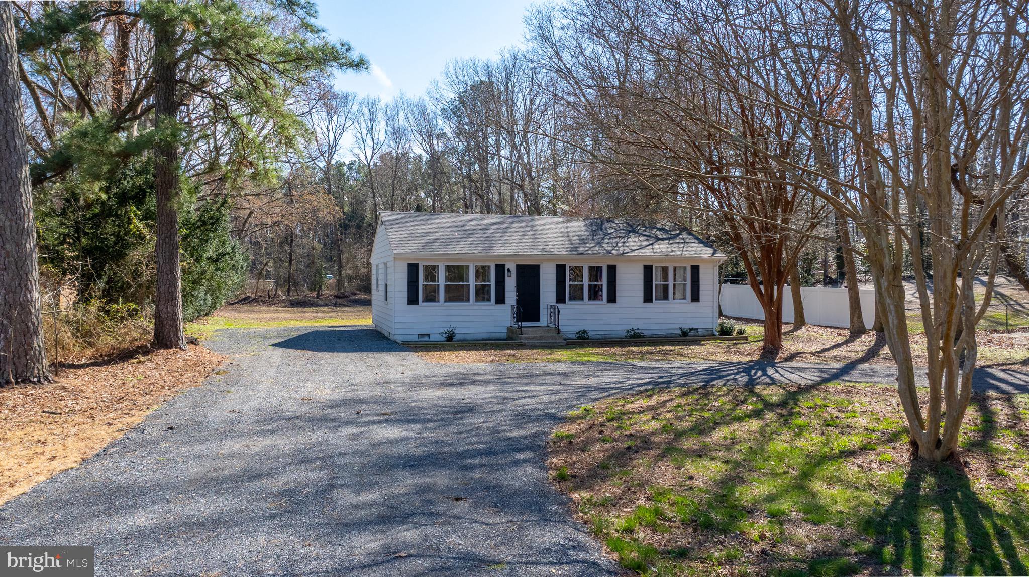 Welcome home to this three-bedroom, one-bathroom property situated on a semi-private lot backed by a mature tree line.
The home was fully renovated in 2023, ensuring the septic system, well, roof, windows and HVAC are all three years old or less. The kitchen features beautiful self-closing white cabinets, solid surface countertops, a double sink, and a tiled backsplash. The bathroom has also been updated with a tiled shower. Additionally, the circular driveway is finished with millings for easy maintenance and accessibility.