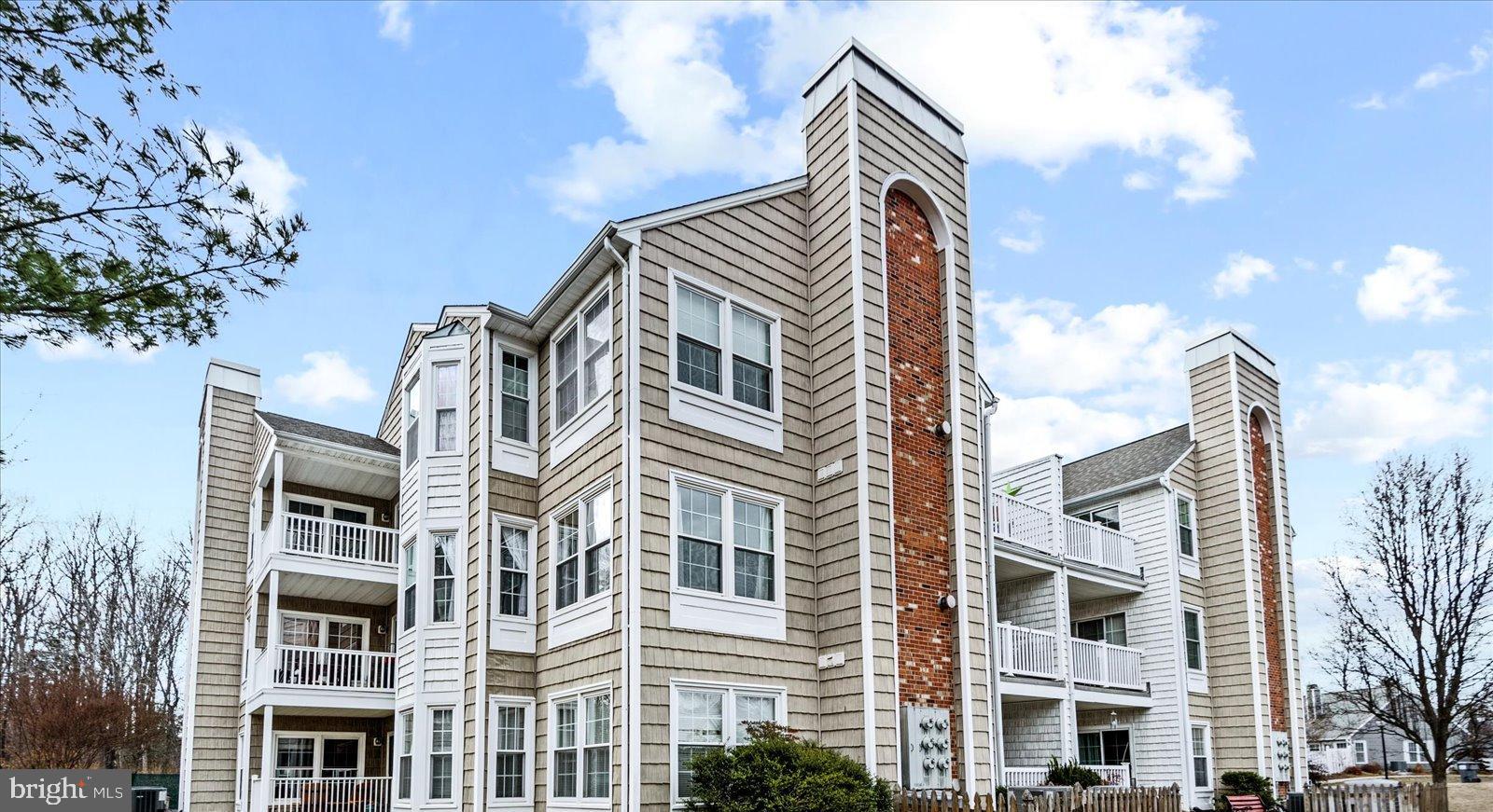Rarely available 3rd floor condo in  Summerlake, the 55+ active community.   Driving into property, you can't help notice all the mature trees.   Only 4 homes per floor so you maintain your privacy and it's easily accessible by elevator. When you step into this home, you will see many windows and lots of light.  The living room has a fireplace making it a cozy area  to watch TV or read a book. There is a designated dining  area that leads to a spacious balcony with a lovely view of tress, water and the community.   The primary bedroom is spacious and has an ensuite. Residents of Summerlake enjoy a gated entry with an attendant on sight M-F.  There is a heated outdoor pool, hot tub, tennis & pickle ball court and clubhouse. The clubhouse has a a large party area with full size kitchen, library and more. There is an on site manager and many resident events and social activities. HOA includes Gas, Trash, & Water. Resident pays electric, heat pump owned by individual.  The community also has a beautiful gazebo that in center of the lake.  Don't miss this opportunity to live in Summerlake, the highly sought after 55+ community. Great location for shopping, restaurants, library, 7-11, & CVS.
