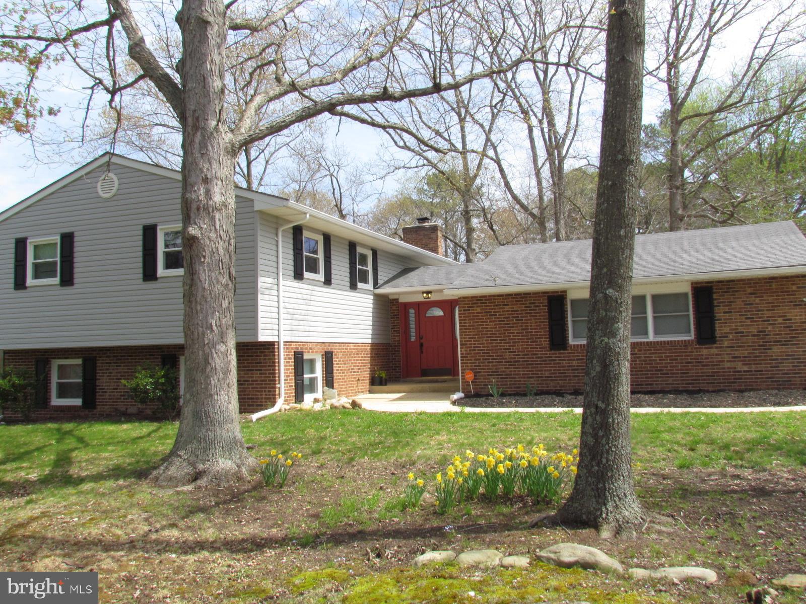 Spacious Split Level home on level lot.Upper level features 3 bedrooms 2 full baths and an open kitchen, living room and dining room. Lower level has family room with wood burning fireplace, large bedroom and full bath. Additional features include SS appliances, granite counter tops, deck, fenced back yard and attached 2 car garage. Owners will consider pets case by case. No smoking allowed in the house.