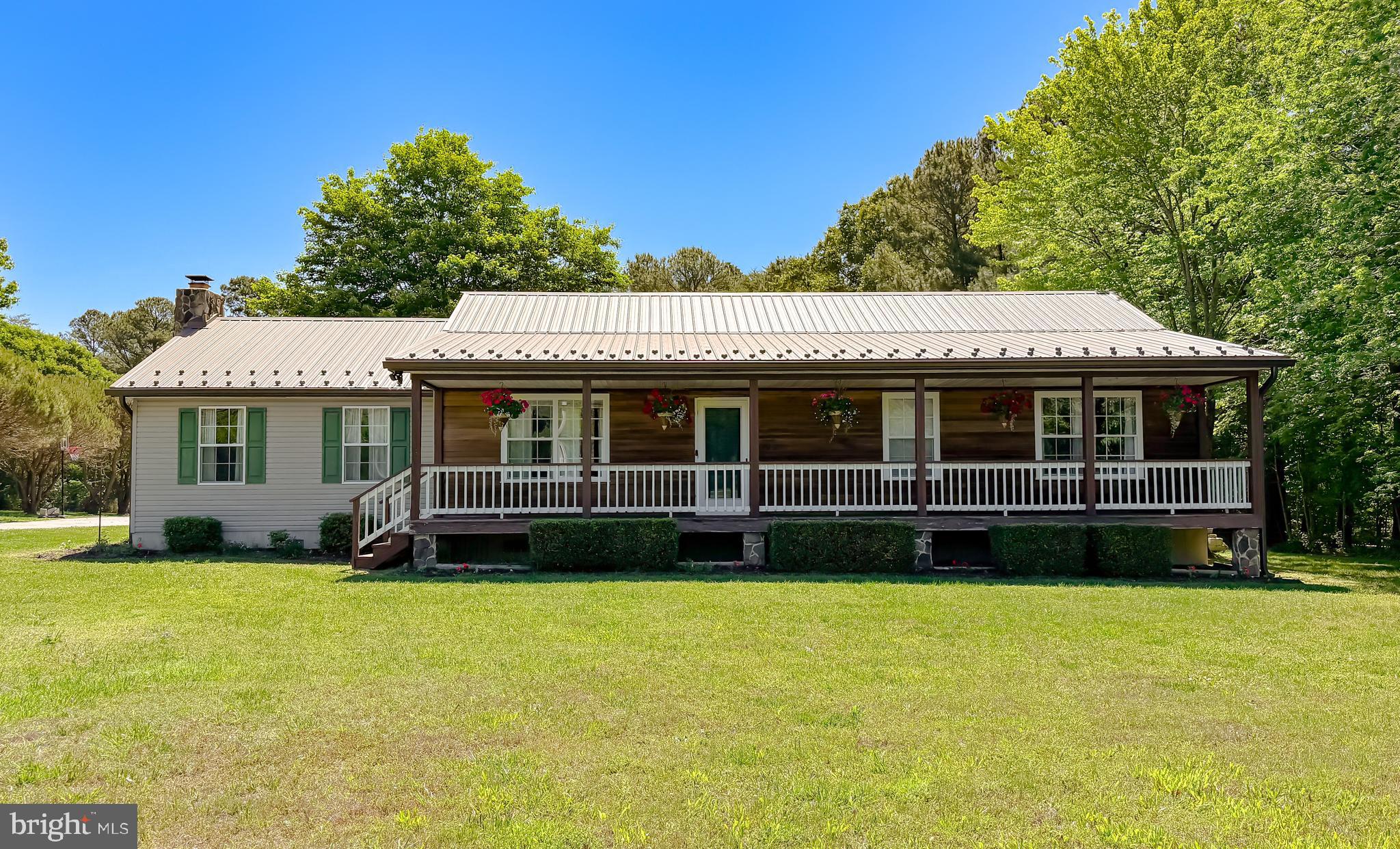 Dreaming of starting your own mini farm without needing endless acreage? Welcome to 31370 Point Lookout Rd: the perfect mix of peaceful country living, modern updates, and functional farm space — all at an affordable price point! Inside, you’ll find updated LVP flooring and carpet, renovated bathrooms, granite countertops, newer stainless steel appliances, and a stunning stone, wood-burning, fireplace at the heart of the home. Major updates include a newer roof, HVAC (2024), water heater (2024), and newly built back deck. Outside is where this property truly shines! The horse barn and pen with water and electricity already in place make this an ideal setup for horse owners or anyone looking to start a hobby farm. The property also includes a sheep barn, former chicken coop/shed, and a massive detached two-car garage complete with cabinetry, workbench space, and a pellet stove. Enjoy the privacy and charm of rural living while still being conveniently located near Pax River, Andrews Air Force Base, Washington DC, shopping, restaurants, and all three Southern Maryland counties. Properties with this kind of setup, functionality, and affordability rarely hit the market — schedule your showing before it’s gone! DO NOT FEED/PET FARM ANIMALS