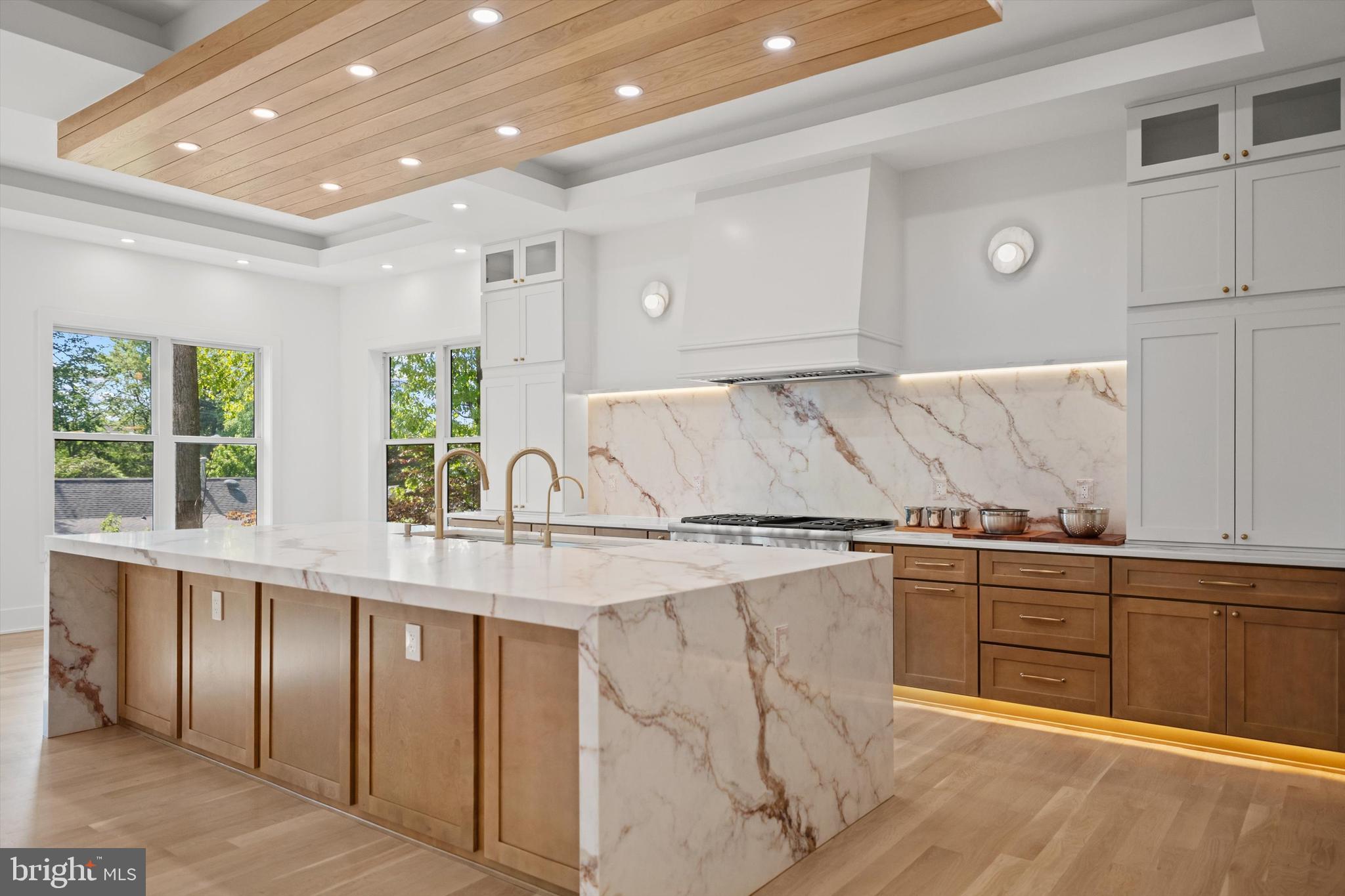 Seize the opportunity to personalize this exquisite custom modern-transitional home in sought-after Pimmit Hills. Currently under construction, this expansive residence offers nearly 8,000 sq ft of refined living space, featuring 7 bedrooms, 7 full baths, 2 half baths, and a 3-car garage, all with convenient access to shopping, dining, and major commuter routes. The main level showcases an open layout with 11’ ceilings with , including  formal living and dining areas, a guest suite, and a chef’s kitchen equipped with top-of-the-line Thermador appliances (60” sink and refrigerator, double dishwashers, gas range, and oven/microwave combo), quartz or granite countertops, and custom cabinetry. The kitchen flows seamlessly into a bright morning room and a spacious family room with a fireplace, opening to a deck, perfect for indoor-outdoor living. A butler’s pantry with a wine cooler enhances the space for entertaining. Upstairs, the luxurious primary suite offers a spa-like bath and expansive walk-in closets, complemented by three additional en-suite bedrooms, a loft/family area, laundry room, and a private balcony. The lower level is an entertainer’s dream, featuring a large recreation room with a wet bar, media room, two en-suite bedrooms, and a walkout to a flagstone patio. Additional unexcavated space provides flexibility for future customization. Don’t miss the chance to make this home your own. Estimated completion: Winter 2026.