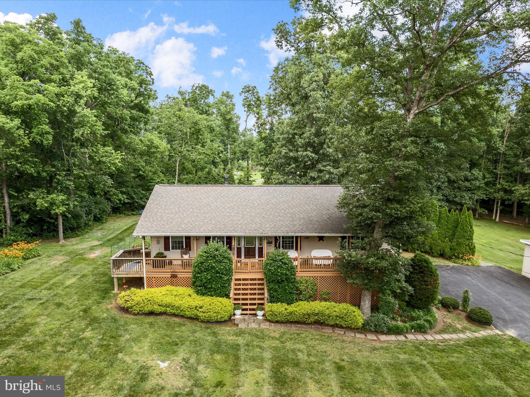A Truly Exceptional, One-Owner Rancher on Expansive Grounds!  A true gem nestled on an impressive 2.82 acres of unrestricted land. This immaculate residence offers a generous floor plan with 3 spacious bedrooms and 2 full baths, complemented by an oversized garage for all your storage needs. The full-length covered front porch invites you to relax and enjoy the scenic beauty of the surrounding landscape.
The meticulously maintained, mature landscaping is nothing short of breathtaking, providing a serene and picturesque setting that enhances the home's natural charm. An additional detached garage offers extra versatility and storage, while the fenced backyard provides privacy and security, perfect for outdoor living or entertainment.
This extraordinary property combines tranquility with convenience and is certain to captivate the discerning buyer. Opportunities like this are rare—call today to schedule your private showing before it’s gone!