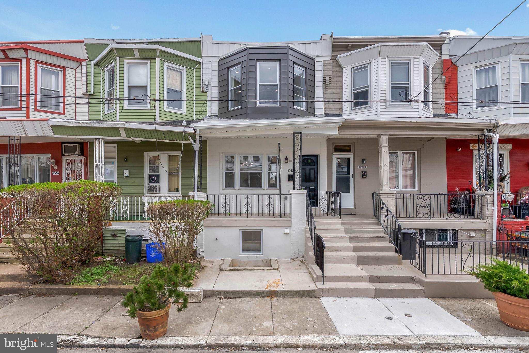 Renovated down to the studs and overflowing with modern finishes, 2340 McClellan St is a thoughtfully rehabbed 2-story home offering 2 bedrooms, 2 full bathrooms, a finished basement for potential 3rd bedroom, central a/c, and a private patio. A quiet, low-traffic block in Point Breeze leads to the sleek black and white facade and a welcoming porch. Inside, gleaming floors stretch across the open and airy main level. A wall of windows allows lots of natural light into the living room, while the dining area has plenty of space for entertaining. At the rear, the sunlit kitchen boasts modern, two-tone blue lower and white upper cabinetry, brand new stainless steel appliances including a dishwasher, quartz counters, and a tile backsplash. Out back, the secluded patio is perfect for summer barbecues and dining under the stars. Up on the second level, the large, bright primary bedroom has tall bay windows and a double closet. Down the hall is a luxurious full bathroom and another sunny bedroom. More living space is found in the finished basement, ideal for a playroom or gym, along with the third bedroom, second full bathroom, and the laundry room. Utilities include central a/c, gas heat, and electric hot water. In addition to everything inside, this fantastic location earns a Walk Score of 80! Steps away, Point Breeze Ave is lined with local restaurants and friendly shops. Popular shopping centers and sprawling parks are also close. Plus, there’s easy access to public transit, Snyder Ave, and I-76. Schedule your tour today!