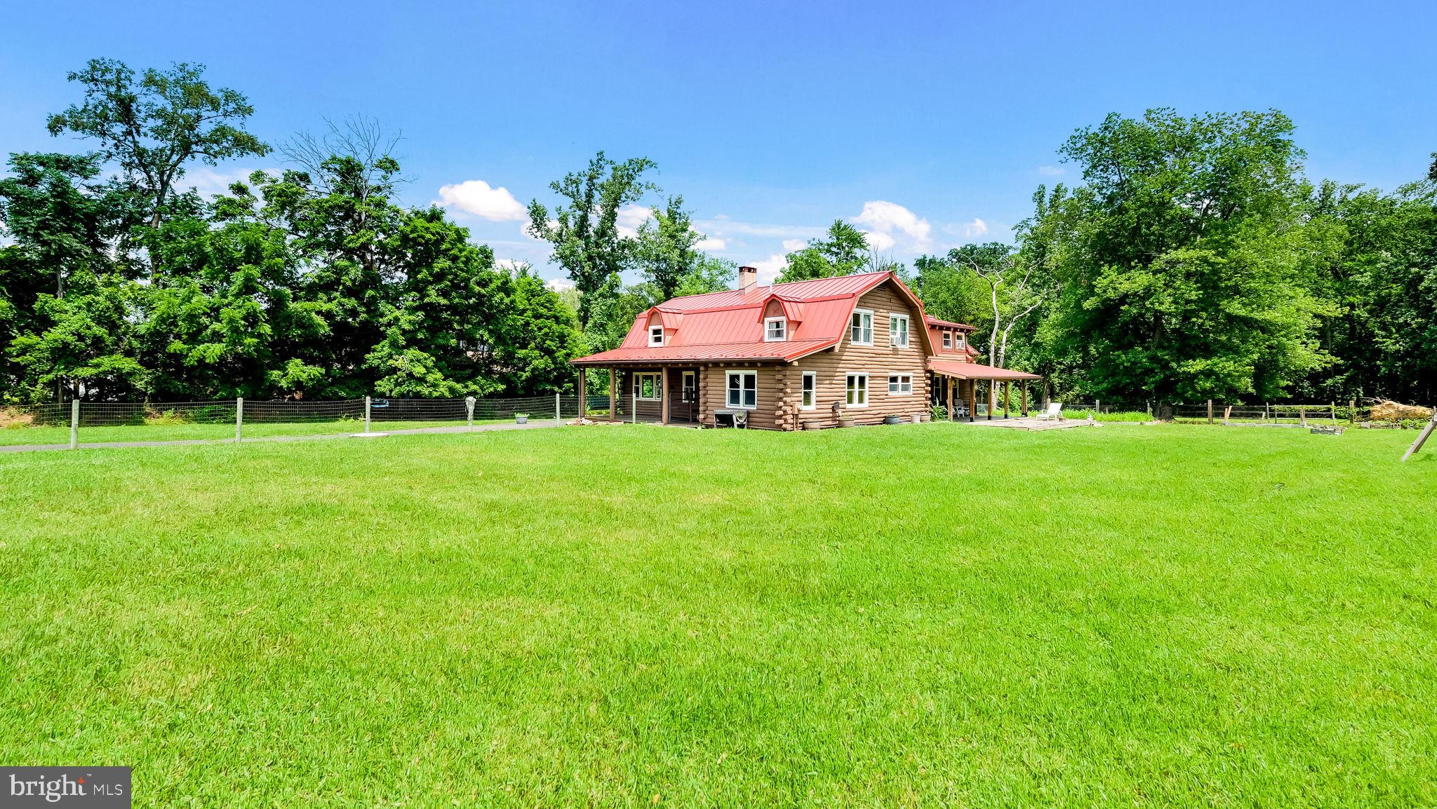 Yes! That is a Log Cabin on 2 acres in Ivyland.  Built in 1989 this rustic home features 4 spacious bedrooms, 2 1/2 baths, full basement, fenced yard and 2 covered porches.  The first floor has a large living area with a pellet stove.  The large Kitchen adjoins the dining area which is great for entertaining.  Off the kitchen there is also access to a Den, Office and play or exercise area. The Den features an additional pellet stove.  A 1/2 bath completes the 1st floor.  Upstairs is the large primary bedroom with a full bath. There is also 3 other bedrooms and an additional full bath. The basement is great for storage and there is a Bilco door.  Other features of this unique home: Newer Oil heater with 3 zones, Newer Metal roof,  200 AMP electric service, Council Rock School District, Andersen Windows, Hardwood floors, Recessed lighting and more!  Just so you know, even though you may feel like you are way out in nature, you are still relatively close to some great places to get provisions.... Showing begin 7/17/2026.