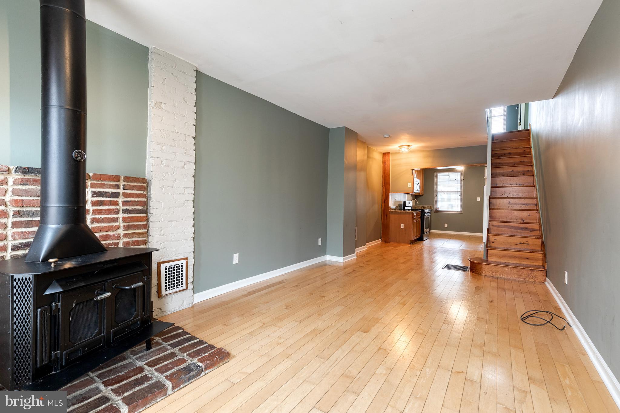 This Beautiful,  MUST SEE 3BR/1.5BA classic Baltimore townhome offers an abundance of natural light, an open concept main floor, high ceiling, and beautiful flooring. The spacious living room features a free standing wood burning stove with a brick hearth. The open flow into the dining area and kitchen makes it ideal when entertaining. The kitchen has tile flooring, wood cabinets, granite counters, and stainless steel appliances. The second floor has two primary sized bedrooms, one with a cedar lined closet, and a full bath. An exposed painted brick wall leads to the lower level with a finished room featuring a wood plank ceiling, built-in shelving and storage closets. A clean and dry laundry/utility room, and a walk-out to the rear completes this space. Last but not least, there is a parking pad!

Monthly rent is priced at $2500/month; first month's rent and one month security deposit needed to move in ($5000). Utilities are not included in the price. Verifiable income of at least 3x monthly rent and 650 minimum credit score is necessary to qualify. Pets are allowed and will be considered on a case to case basis.