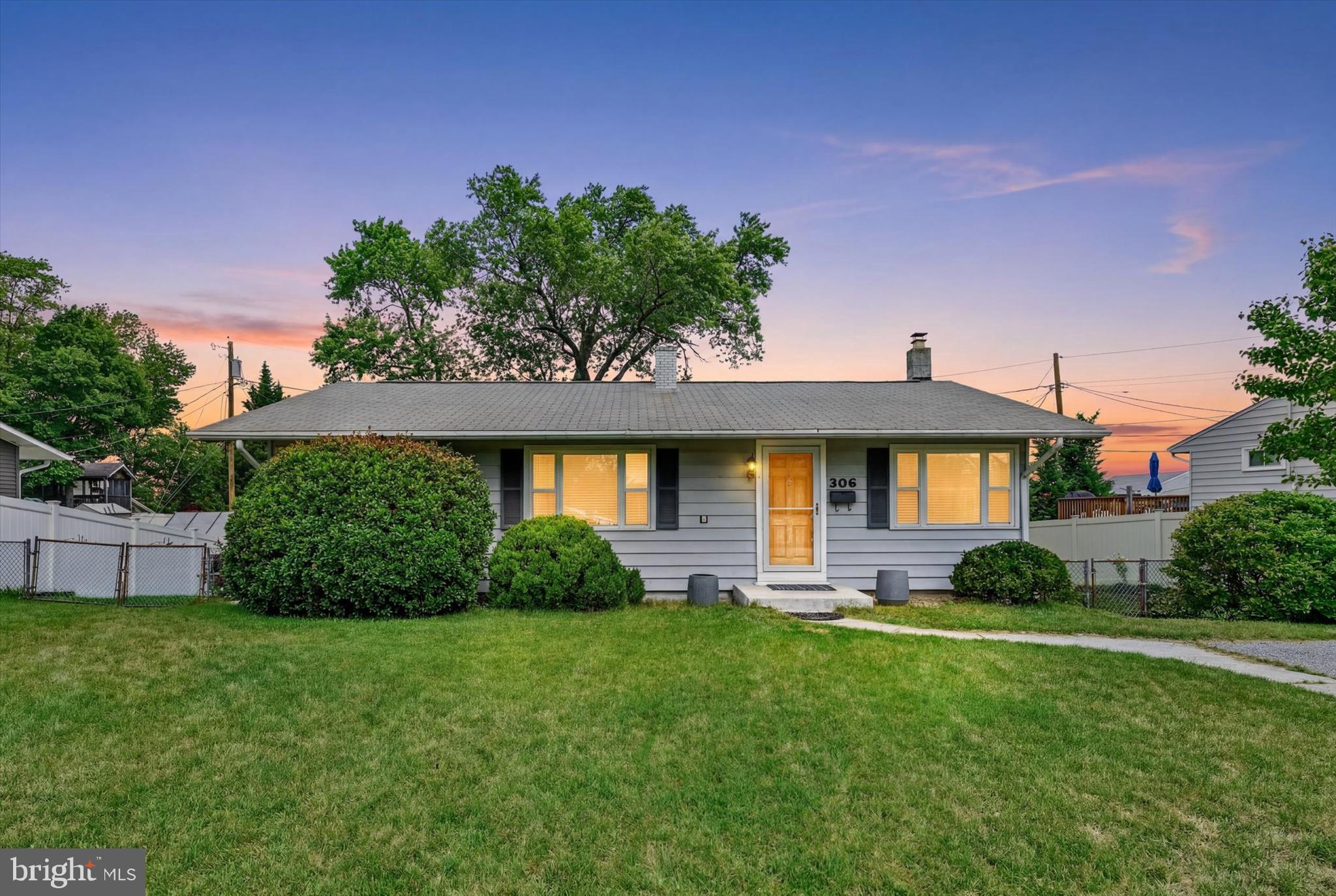 Welcome to 306 Regency Circle, a classic two-level rancher offering a functional floor plan, generous living space, and an excellent opportunity. Positioned high on a hill with excellent visibility, off-street parking, and convenient  to major commuter routes, shopping, dining, and employment centers, this home combines everyday convenience with exciting future potential.
The main level welcomes you with original hardwood flooring and a bright living room filled with natural light. The open kitchen and dining layout creates an easy flow for everyday living and entertaining. Stainless steel appliances, including the dishwasher, gas range, and refrigerator, were replaced- ‘21. The dining area overlooks and provides direct access to the three-season screened porch, extending the living space outdoors while offering elevated views of the fenced backyard.
Three bedrooms are conveniently located on the main level, including the owner’s bedroom and a second bedroom, both of which offer direct access to a shared Jack-and-Jill half bath. The third bedroom provides comfortable accommodations for family or guests and can also be used as a dedicated home office. The full hall bathroom features cabinetry refreshed and add additional exhaust fan replaced–‘26.
The finished lower level significantly expands the home’s usable living space and provides tremendous flexibility for a recreation room, or potential fourth bedroom. Plush carpeting and padding were updated-‘17, creating a comfortable and inviting atmosphere. A walkout from the recreation area leads to a covered concrete patio, resurfaced-‘22, and the fully fenced backyard. The lower level also features an impressively sized laundry, utility, and storage area with a Whirlpool washer-‘23 and a Whirlpool dryer- ‘20. Additional improvements include: waterproofing system and sump pump- ‘14, along with insulation added to the attic and basement walls.
The property offers multiple outdoor spaces for relaxing, entertaining, and enjoying the surrounding setting. Perched above the backyard, the screened porch provides a panoramic view and a welcoming place for morning coffee, casual dining, or unwinding at the end of the day. The covered lower-level patio offers a second private gathering area with shade and protection from the elements, making it ideal for grilling or creating a comfortable outdoor lounge. The fenced backyard provides room for pets, play, gardening, and future outdoor enhancements, while the storage shed offers convenient space for lawn equipment, tools, and seasonal items. Shed updates and landscaping improvements were completed in 2026. Additional exterior improvements include a replaced front concrete step-‘22 and an updated front storm door-‘20, adding both function and curb appeal.
Several major improvements further enhance the home’s comfort and functionality, including a water heater replaced -‘20, a central air-conditioning system installed in '23, gutter improvements- ‘17, and roof repairs and maintenance completed- ‘26 with a roof repair work includes a transferable five-year warranty.
While the home retains some original finishes, it offers an exciting opportunity to add personal style and complete cosmetic updates over time. Its flexible two-level layout, major system improvements, outdoor living spaces, and convenient commuter location provide immediate functionality with strong long-term potential for an owner-occupant or investor.
Fantastic shopping, recreational parks, trails, and restaurants and more minutes away. Conveniently located to major routes 100, I-695, I-95, 295, 32, 495. It offers a convenient commute to Washington DC/Northern VA, Baltimore City, Fort Meade Military Base, NSA headquarters, CIA headquarters, DISA, and US Cyber Command, BWI International Airport making it ideal for both government and private-sector professionals.
