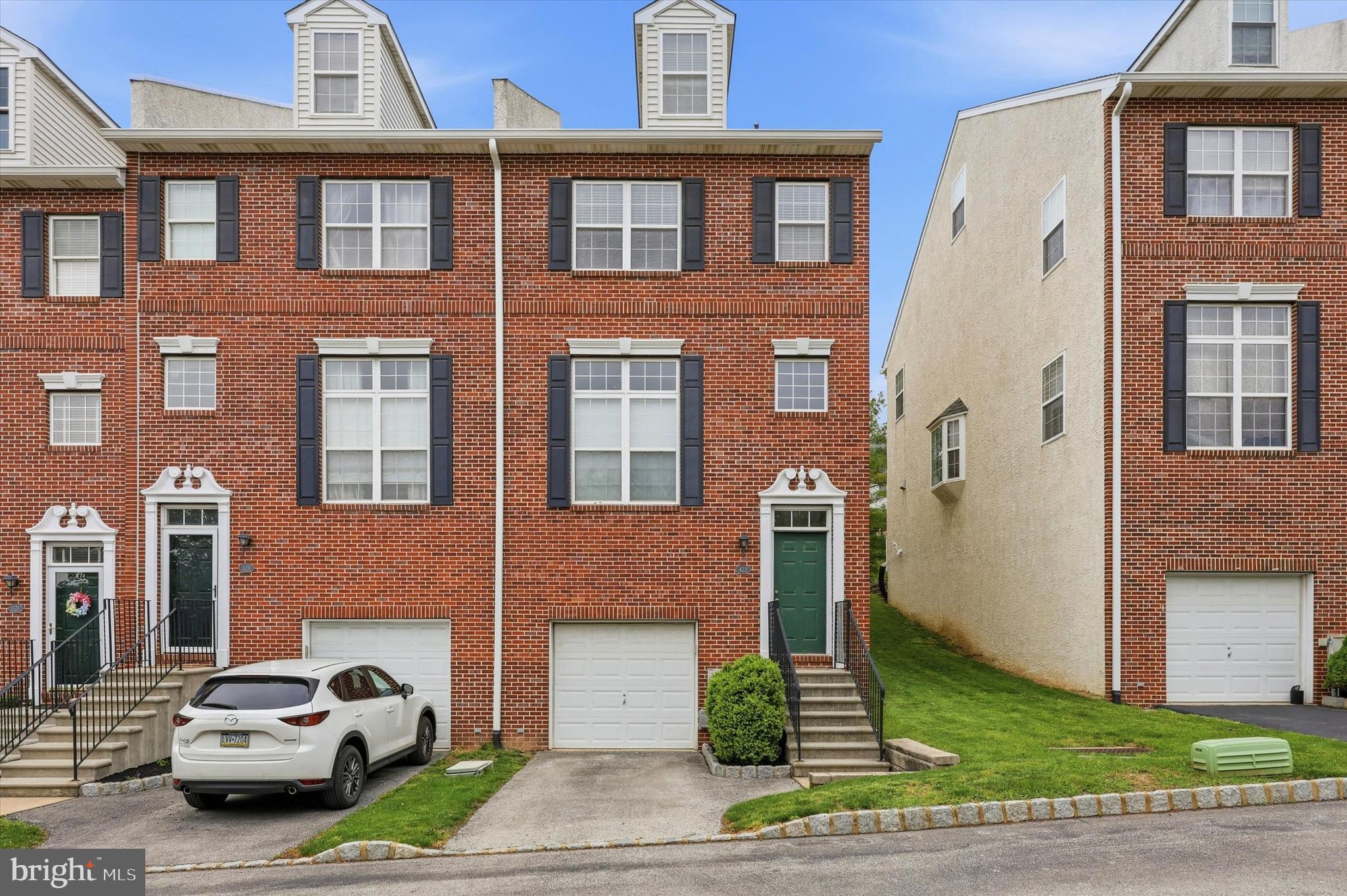 Discover the perfect blend of comfort, style, and convenience in this beautifully maintained end-unit townhome in the highly sought-after Freedley Square community of Conshohocken. Filled with natural light and featuring soaring ceilings and an open-concept layout, this spacious home offers an inviting atmosphere from the moment you step inside. The cozy living room is anchored by a fireplace and flows seamlessly into the dining area and updated kitchen, complete with granite countertops, white cabinetry, stainless steel appliances, and a breakfast bar ideal for everyday living and entertaining. Sliding doors off the kitchen lead to a private deck, creating the perfect extension of indoor and outdoor living space. Upstairs, the spacious primary suite features a walk-in closet and private en-suite bath, while the generously sized second bedroom offers ample closet space. A full hall bathroom and convenient second-floor laundry complete this level. The versatile third-floor loft provides endless possibilities as a home office, gym, guest space, or third bedroom. The finished lower level adds even more flexible living space and includes access to the attached one-car garage. Located in the award-winning Colonial School District, this home is just minutes from Fayette Street’s popular restaurants, shopping, nightlife, the train station, Schuylkill River Trail, and major highways, making commuting to Center City or exploring nearby destinations like Valley Forge incredibly convenient. A rare opportunity to own a spacious and stylish home in one of Conshohocken’s most desirable locations.