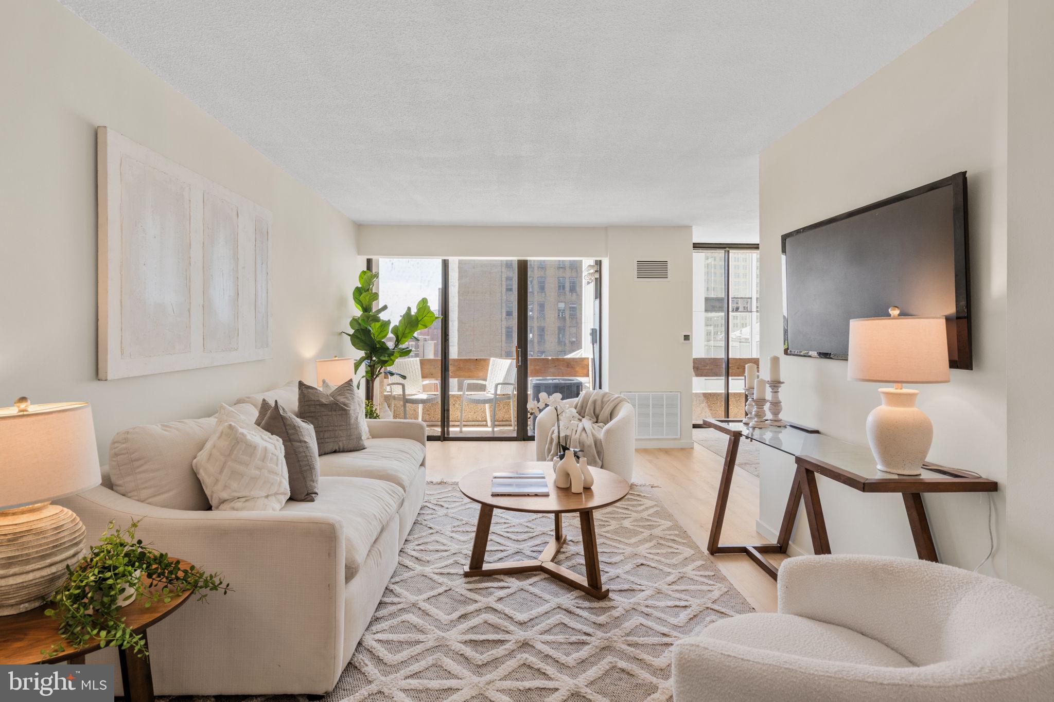 Brand new luxury vinyl flooring and a newer HVAC system offer great value and ease to move right in to this sun-filled corner one-bedroom condo with two south-facing balconies. Enjoy floor-to-ceiling windows which flood the open living and dining areas with natural light. The updated kitchen has quartz countertops, gas range, microwave, dishwasher, and stainless steel refrigerator, plus counter seating for two. The large bedroom includes a walk-in closet, generous storage and a custom built desk. Plus, there's in-unit washer and dryer and additional storage space in building for added convenience.

Full-service building with 24-hour doorman, on-site management, and attached parking garage (spaces available periodically for rent or purchase). Unbeatable Center City location—across from the Kimmel Center, one block to the subway and many top restaurants within blocks. HOA includes heat, water, and standard cable with HBO, owner pays electric.