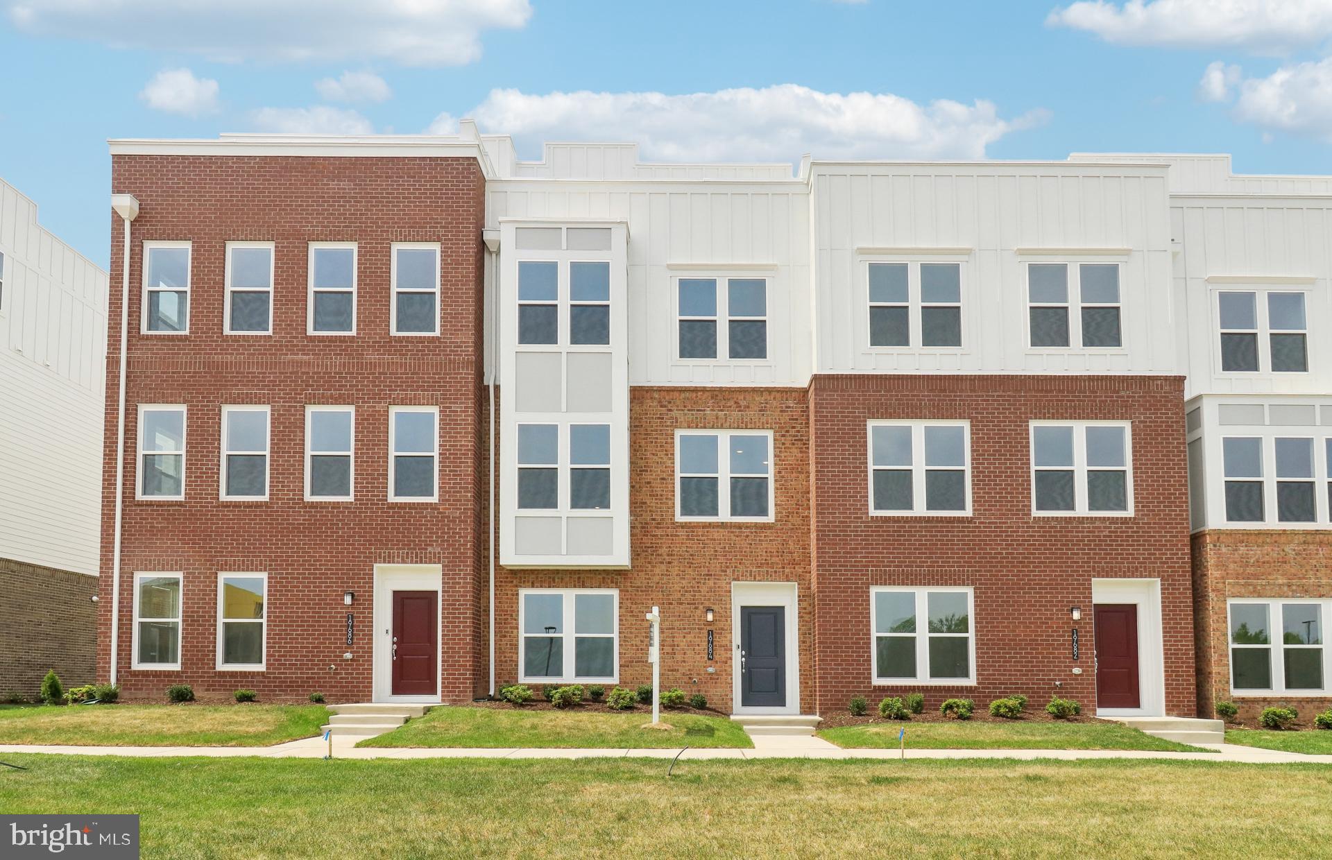 NEW CONSTRUCTION - Available for a May/June of 2025 Closing. $25,000 in Closing Costs tied with the use of Pulte Mortgage Corporation. This 4 level Halston Way townhome offers spectacular views from an outdoor Rooftop Terrace!  It includes 4 bedrooms, 4.5 bathrooms.  The first floor offers a 2-car rear entry garage with an EV rough-in plug.  The first floor also offers a full bathroom with a tile shower and bench seat as well as a frameless glass enclosure.  The versatile flex room with French doors that can be used as a home office or exercise room or hobby room.  Upstairs on the main level, a rear kitchen opens to a sizable cafe and gathering room with a Scion 55' electric fireplace with a beautiful 12" x 24" tile surround.  The gourmet kitchen offers upgraded Kitchen Aid stainless steel appliances, Soft-close Greyhound kitchen cabinets with Calacatta Laza Quartz countertops and 1" x 4" Herringbone - Nautical Gray backsplash. A powder room, coat closet, and step-in pantry are located on this level.  Enjoy the outdoors with an included 8' x 18' Deck located off the kitchen!  For the chef that loves to grill, a gas line stub out has been installed.  On the 3rd floor, you’ll find 3 bedrooms along with a convenient laundry room. The owner’s suite has a large walk-in closet and the owner’s bath has 12" x 24" Calacatta Empire floor and wall tiles and a frameless shower door. The 4th Floor includes an great sized loft, a beverage center and an additional bedroom and a full bath with a tiled, walk-in shower and bench seat and a frameless glass enclosure.   Off the loft is a Rooftop Terrace with an outdoor gas fireplace for you to enjoy. This home has upgraded wiring package, Oak stairs and 7" LVP are throughout this gorgeous townhome.  This home has a Rinnai tankless water heater located in the mechanical room off the garage.