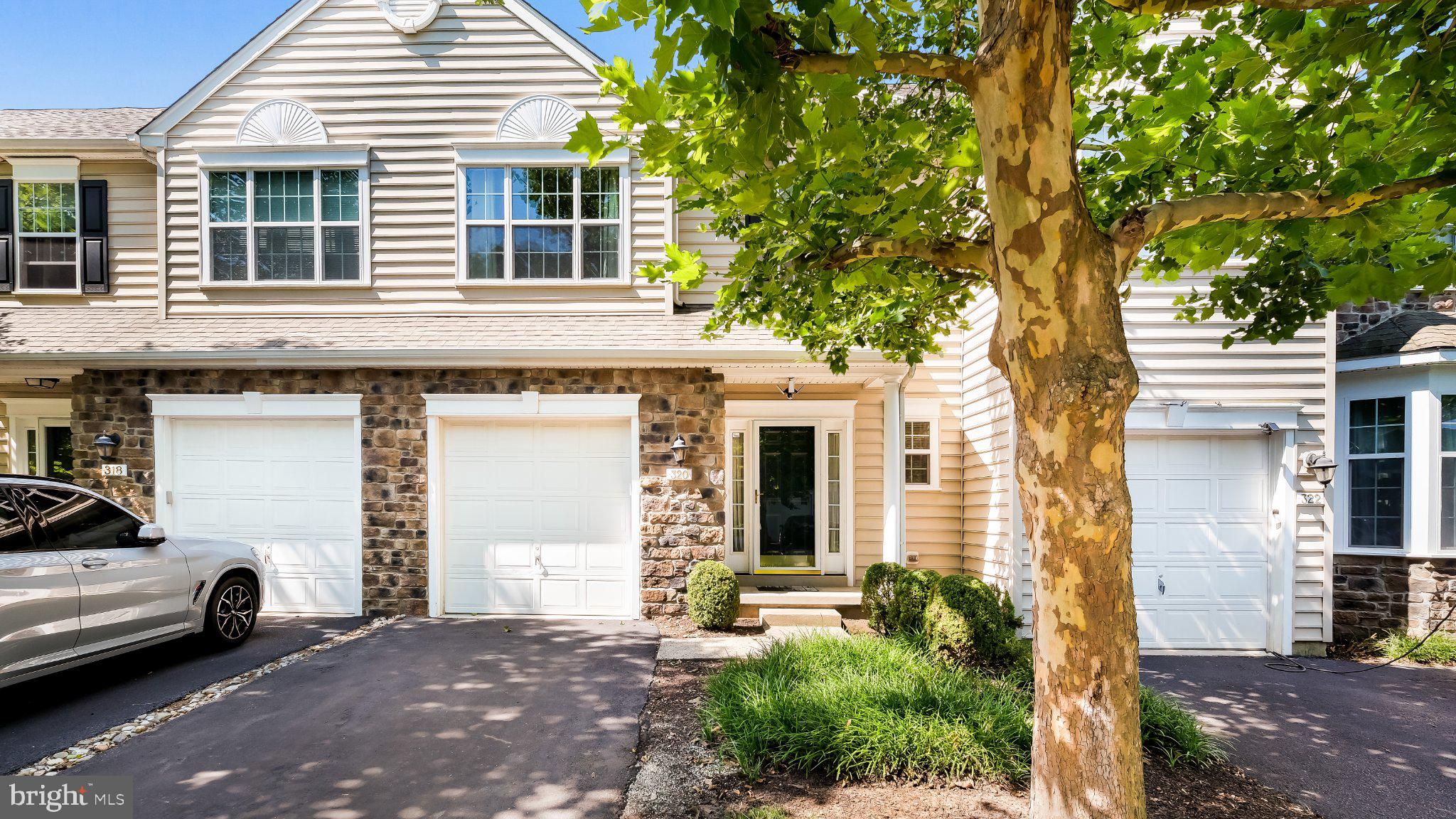 Welcome to this beautifully maintained 3-bedroom, 2.5-bath townhome offering spacious living and timeless finishes. Rich hardwood flooring flows throughout the entire home, creating a warm and cohesive feel.

Step inside to a generously sized foyer that opens to an inviting floor plan, seamlessly connecting the formal dining area, expansive living/family room, and the well-appointed kitchen. The kitchen is equipped with quality stainless steel appliances, abundant cabinet and counter space, an island with barstool seating, and an adjoining breakfast area. Just beyond, the bright sunroom provides additional living space and opens to the rear deck overlooking a peaceful backyard bordered by mature evergreen trees for added privacy.

Upstairs, you'll find three generously sized bedrooms, all with hardwood flooring. Two spacious secondary bedrooms share a well-appointed hall bath, while the impressive primary suite offers a large walk-in closet and a private en-suite bath complete with a soaking tub and separate walk-in shower.

Complete with an attached one-car garage and conveniently located near shopping, dining, parks, and major commuter routes, this move-in-ready home combines comfort, space, and an ideal location.