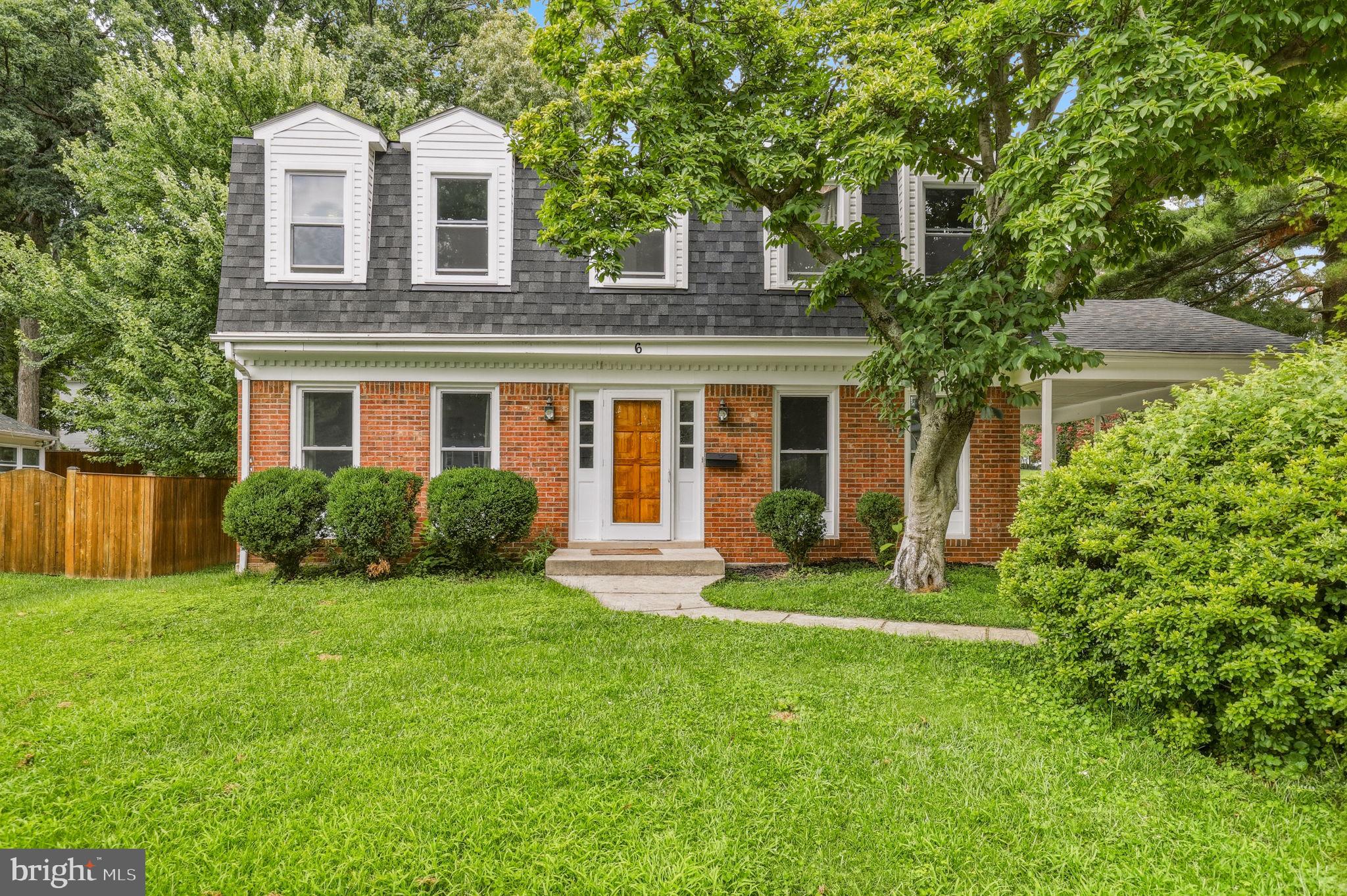 Incredible brick colonial located in the desirable Brighton East community of Gaithersburg! This spacious four-bedroom, three-full- and one-half-bath home offers a bright, open layout with abundant natural light and luxury vinyl plank flooring throughout. The oversized eat-in kitchen features granite countertops, white cabinetry, stainless steel appliances, recessed lighting, generous workspace, and an adjoining dining area with a charming painted-brick fireplace and direct access to the backyard.
The main level also includes a spacious living room, graceful arched openings, and an impressive home office or flex room with built-in shelving—perfect for working from home. Upstairs, the expansive owner’s suite offers multiple windows, excellent closet space, and a private en-suite bathroom. Three additional generously sized bedrooms and updated bathrooms complete the upper level.

The finished lower level provides exceptional additional living space, including a large recreation area, built-in shelving, a full bathroom, and a versatile bonus room ideal for guests, a home gym, playroom, or second office. Outside, enjoy a large, level backyard surrounded by mature trees, a patio for grilling and entertaining, and a deep covered carport with convenient side entry.

Major improvements include a new roof in 2023 and a new water heater in 2025. Offering an abundance of space, flexible living areas, thoughtful updates, and a fantastic backyard, this beautiful home is ready for its next owner!