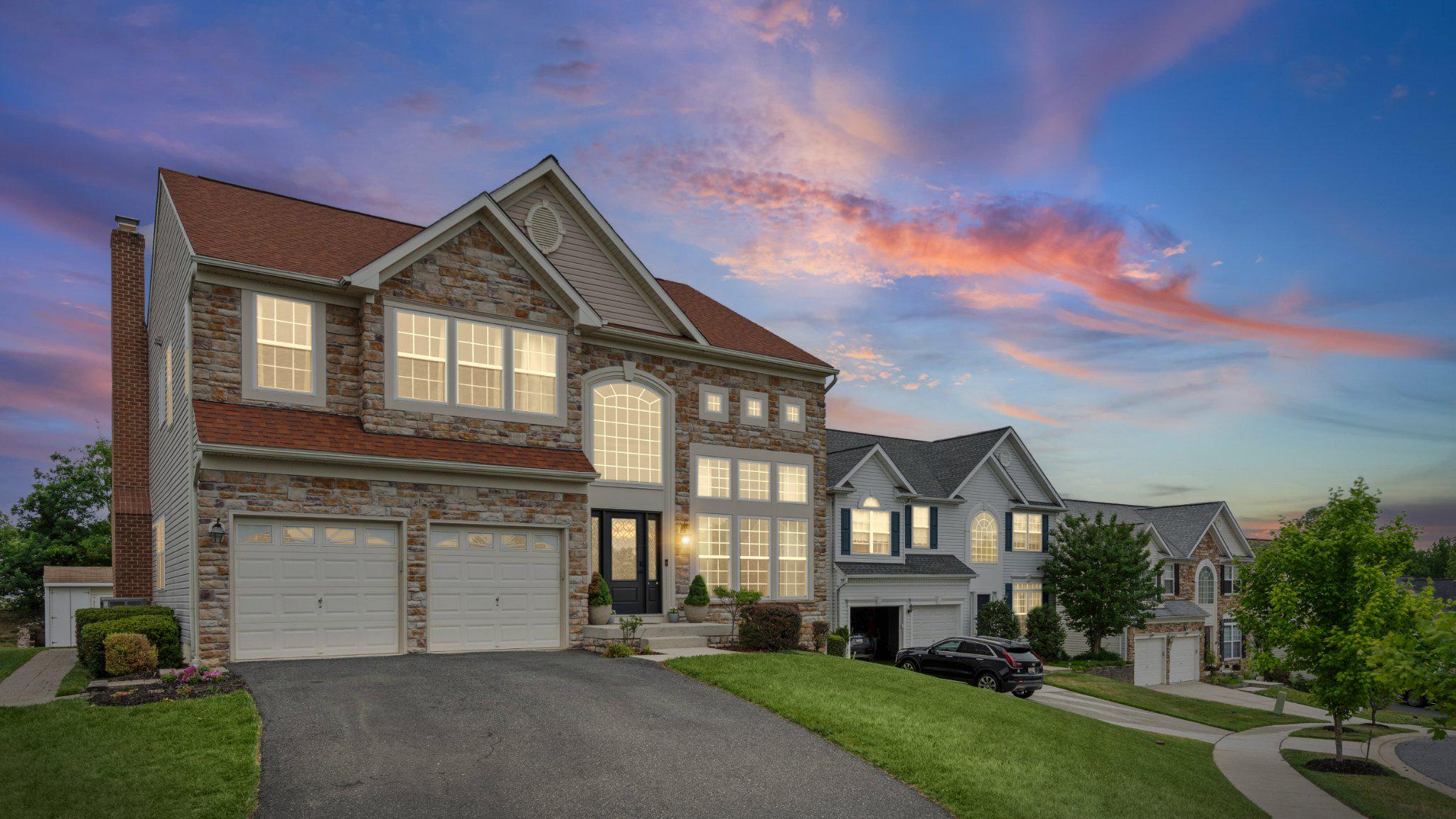**Multiple offers received, best & final offer deadline with no escalation clauses due by Tuesday, June 2 @ 9pm** Welcome to this stunning stone-front Colonial, showcasing exceptional curb appeal, professional landscaping, and a dramatic Palladian window that immediately captures your attention. Offering three fully finished levels of living space, this meticulously maintained home impresses from the moment you step inside with a soaring two-story foyer and living room, elegant 9+ foot ceilings throughout the main level, and dual staircases leading to the upper level. The formal dining room is richly appointed with crown molding, chair rail, and wainscoting, while the spacious family room is anchored by a cozy fireplace. The recently updated gourmet eat-in kitchen is truly a showstopper, featuring quartz countertops, a matching quartz backsplash, oversized quartz island with seating for 3-4 and custom pop-up charging stations, black stainless steel appliances, a dedicated coffee station, and a pantry. Just off the kitchen, the light-filled breakfast room boasts cathedral ceilings and French doors leading to your private outdoor retreat complete with a brick paver patio and walkway—perfect for relaxing or entertaining. The main level is completed by a private office with double glass-panel doors and a convenient powder room.

The upper level hosts a luxurious primary suite featuring updated hardwood flooring, cathedral ceilings, a walk-in closet, and a spa-inspired ensuite bath with a frameless glass shower, ceramic tile surround, jetted soaking tub, and dual vanities. Three additional generously sized bedrooms—including two with ceiling fans and one accented with crown molding—plus a full hall bathroom and convenient upper-level laundry closet complete the upper floor.

Designed for both entertaining and everyday enjoyment, the fully finished lower level offers an expansive game room featuring engineered hardwood flooring, walk-up access to the rear yard, and a custom wet bar with granite countertops and a stylish 1x1 tile backsplash. A spacious rec room and dedicated fitness room provide additional versatile living space with carpeting throughout, while a full bathroom adds extra convenience. Complete with an oversized two-car attached garage and rear storage shed, this exceptional home offers the perfect blend of luxury, comfort, and functionality.