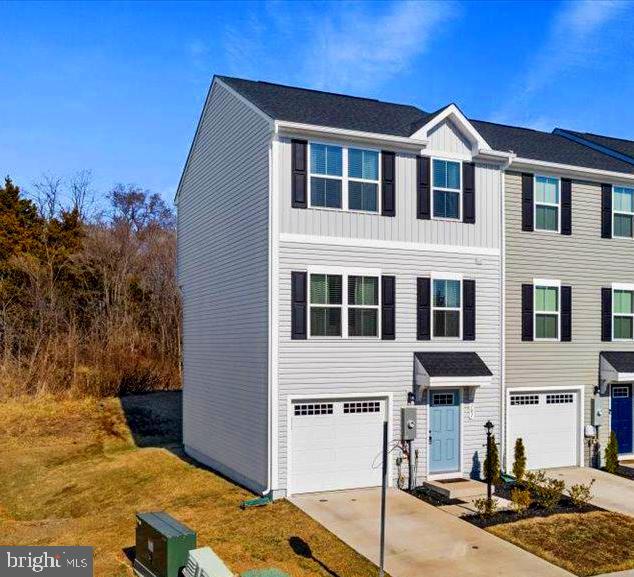 Seller will contribute $5,000 toward closing costs with an acceptable offer! PRICE Improvement and Move in READY! Welcome Home! This Amazing 1.5-year-old End Unit Townhome has 3 Bedrooms, and 2.5 baths located on a wonderful Corner Lot that backs to the Trees. Upstairs the Kitchen is open to the Spacious Family room, it has upgraded laminate flooring, a dining area, a Powder room and an exterior back deck. Perfect for entertaining! On the 3rd level the Primary bedroom also has upgraded laminate flooring, full bath and large Walk-in closet. The additional 2 bedrooms are good size with ample closet space, a full hall bath and Convenient upstairs laundry with washer and dryer that conveys. Schedule your appointment today to tour this Move in Ready home. Motivated Sellers have found their home of choice! Buyer had a change of plans. Great opportunity. Call listing agent for more information!
