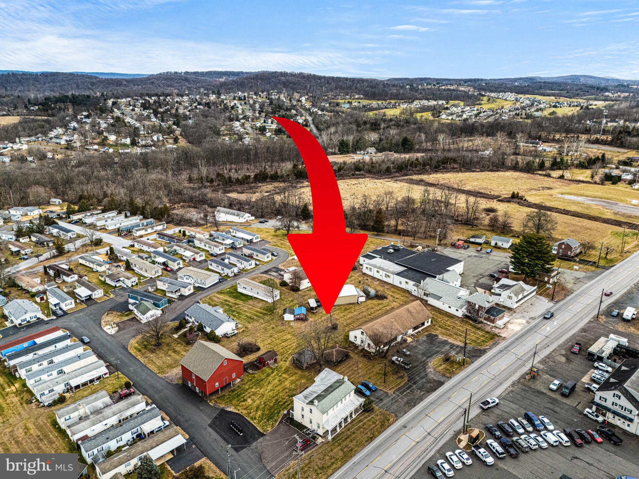 High Visibility, Mixed-Use Commercial property located along busy High Street/Ridge Pike (with over 16,000 cars per day) and just off the Sanatoga exit of Route 422.  This 2 +/- acre level and rectangular tract offers over 300 feet of frontage and includes a 4000 square foot retail building,  stately farmhouse converted into 4 residential units, an historic 1750 SF bank barn, and 1300 SF heated pole building.  Attractive Gateway Interchange Zoning offers a wide range of potential uses including retail, professional and financial office, automotive sales and service, restaurant including drive through and fast food, barbershop/salon, day care/preschool, pet service/veterinary, and many other potential applications.  The  present day  40x100 free-span commercial building has served as a popular antique store for over a century.  The current retail space lease ends in 2026.  The original farmhouse, situated on the very southeastern corner of the property, was converted in the 1990s  into 4 one-bedroom apartments, each with separate heat, electric, and central air utility services.  The apartments are fully occupied. The heated 1300 SF pole barn/workshop with two overhead garage doors,  and the vintage  1600 SF red bank barn with brownstone foundation represent potential additional income generating sources.  Whether you utilize the existing array of buildings for your business venture or construct a new structure on the property, the high visibility location combined with exceptional convenience to Route 422 create an ideal environment for growth.